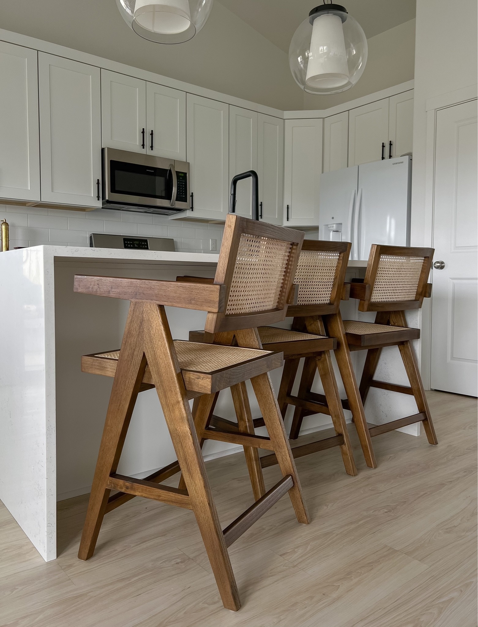 Walnut wood cane bar counter stool. Modern, mid century, transitional kitchen chairs 

#LTKhome #LTKCyberweek #LTKsalealert