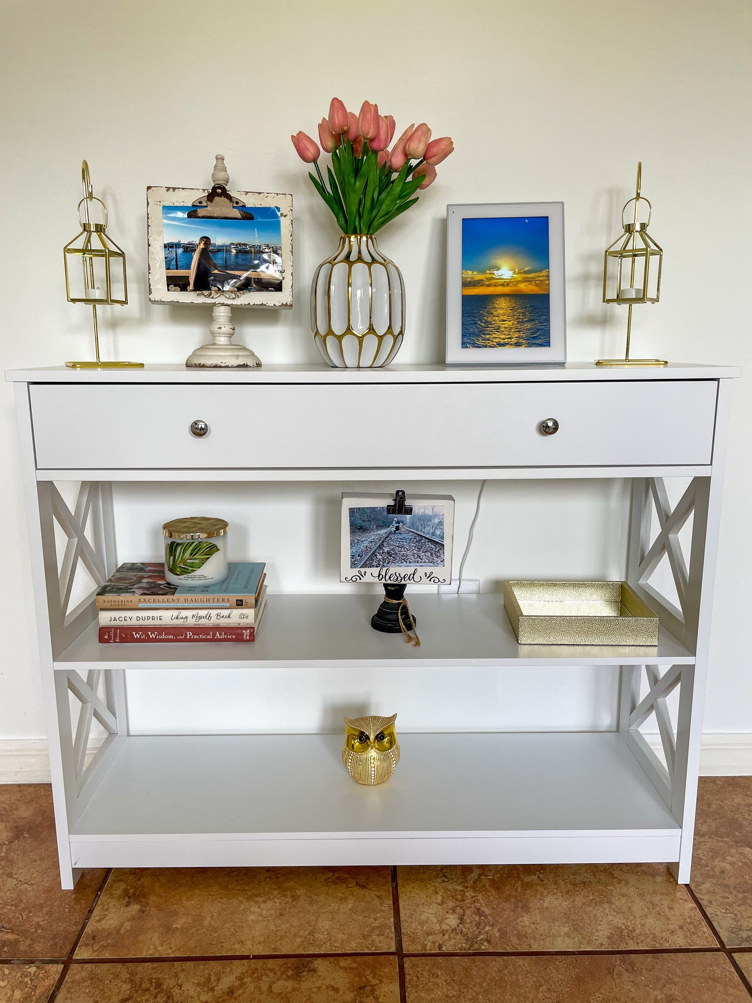 Love how the decor for this hallway table turned out. We added a couple of picture frames, flowers, books and some decor items to complete the look. Love how the digital frame allows us to display a variety of pictures. #amazonhome #founditonamazon

#LTKhome