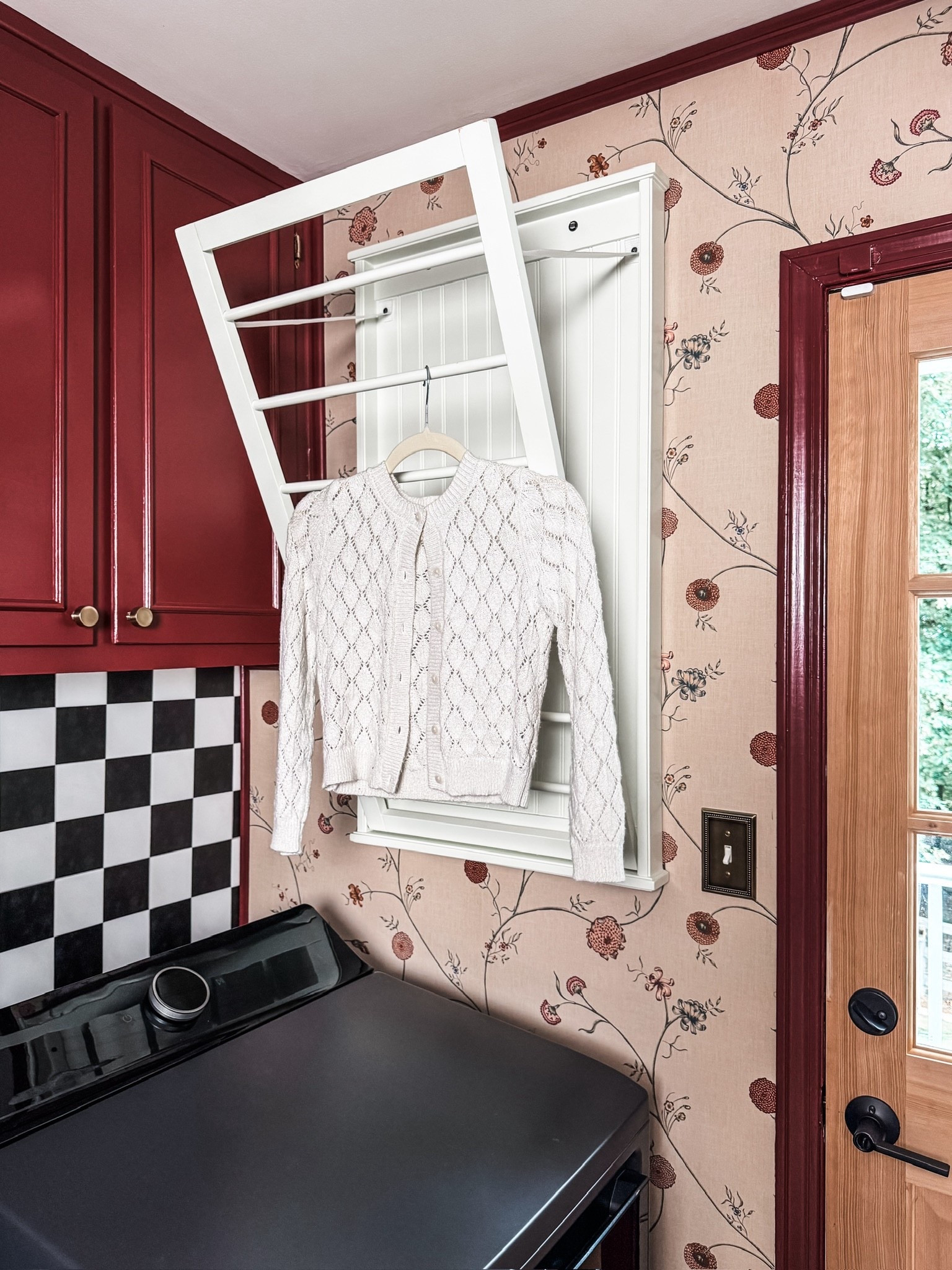 Function meets charm in this laundry space 🌿 A modern washer + dryer, bold red cabinets, and floral wallpaper make a statement. The black-and-white checkered backsplash adds a playful touch, complemented by herringbone brick floors. A wood + glass door, rolling organizer, and black lint bin complete the space with style + practicality. ✨

#LaundryRoomDesign #LaundryInspo #BoldCabinets #WallpaperLove #CheckeredTile #BrickFloorStyle #WoodDoorDesign #LaundryStorageSolutions #WasherDryerCombo #LintBinStorage #eanesinteriors



#LTKdayinmylife #LTKHome #LTKmomlife