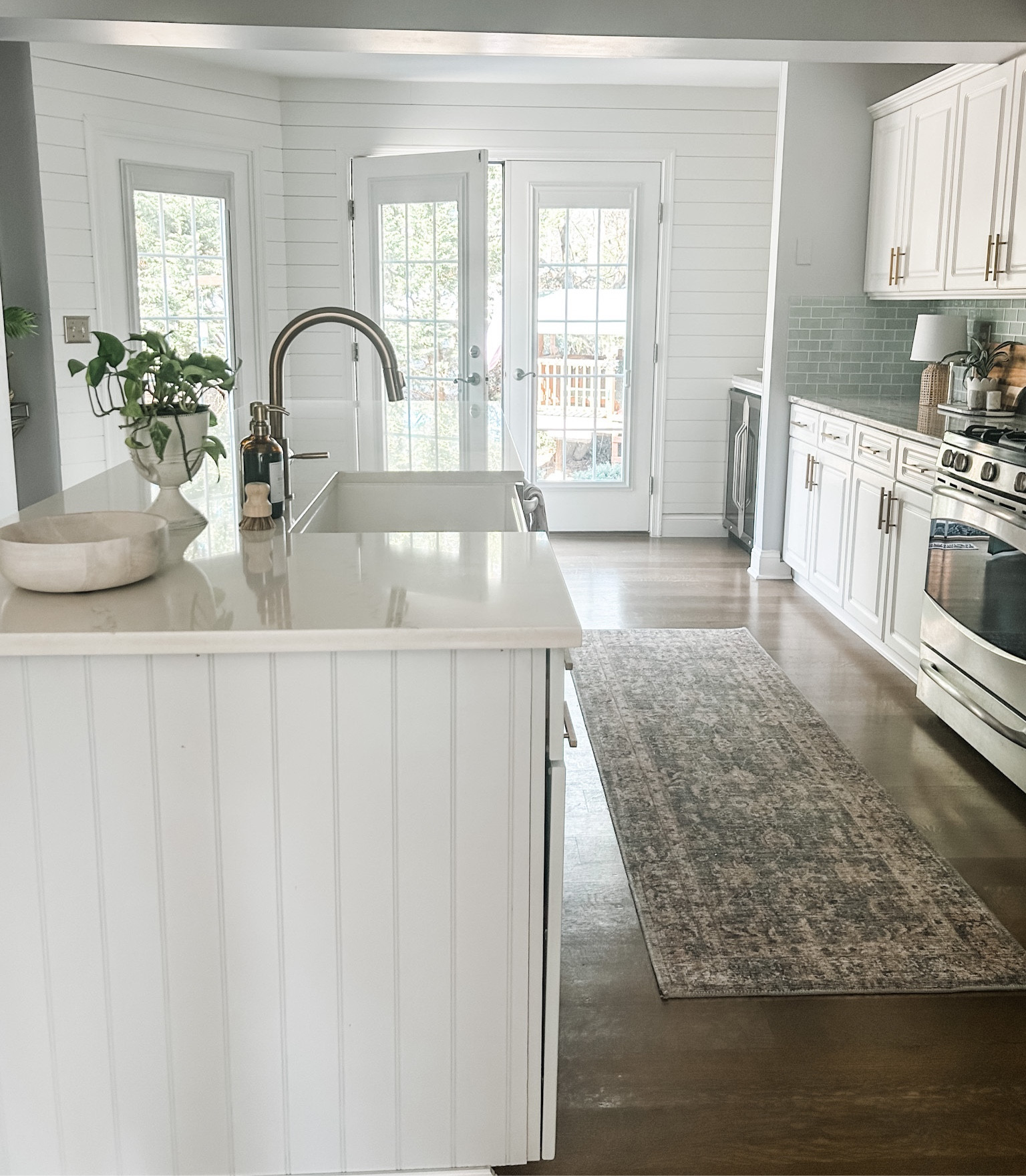 Kitchen Decor.
Kitchen runner, Loloi Rug, Loloi Kitchen runner, Champagne Bronze Kitchen Faucet, Farmhouse sink, Gold Knobs, Bronze Pulls, Kitchen Hardware, Soap Dispenser, Glass Amber Soap Dispenser, Palm Pot Scrubber.

See the full Demo & DIY of this budget kitchen renovation on heatherkrout.com

#LTKhome #LTKFind #LTKstyletip