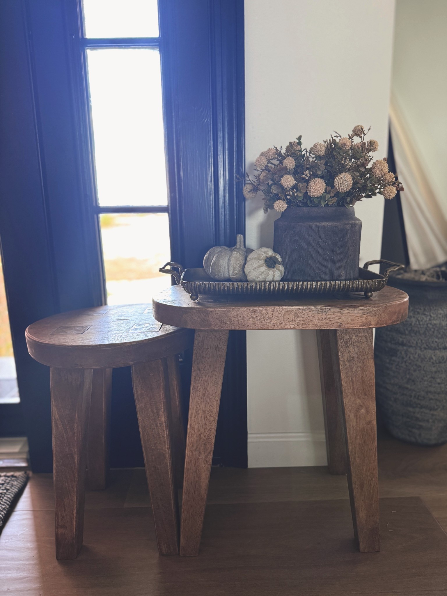 Simple + cozy fall styling 🍂✨ A rustic tray, moody vase, soft florals, and a couple of stone pumpkins make the perfect seasonal touch without overwhelming the space. Everything linked for you! #LTKhome #FallDecor #NeutralHome #ConsoleTableDecor