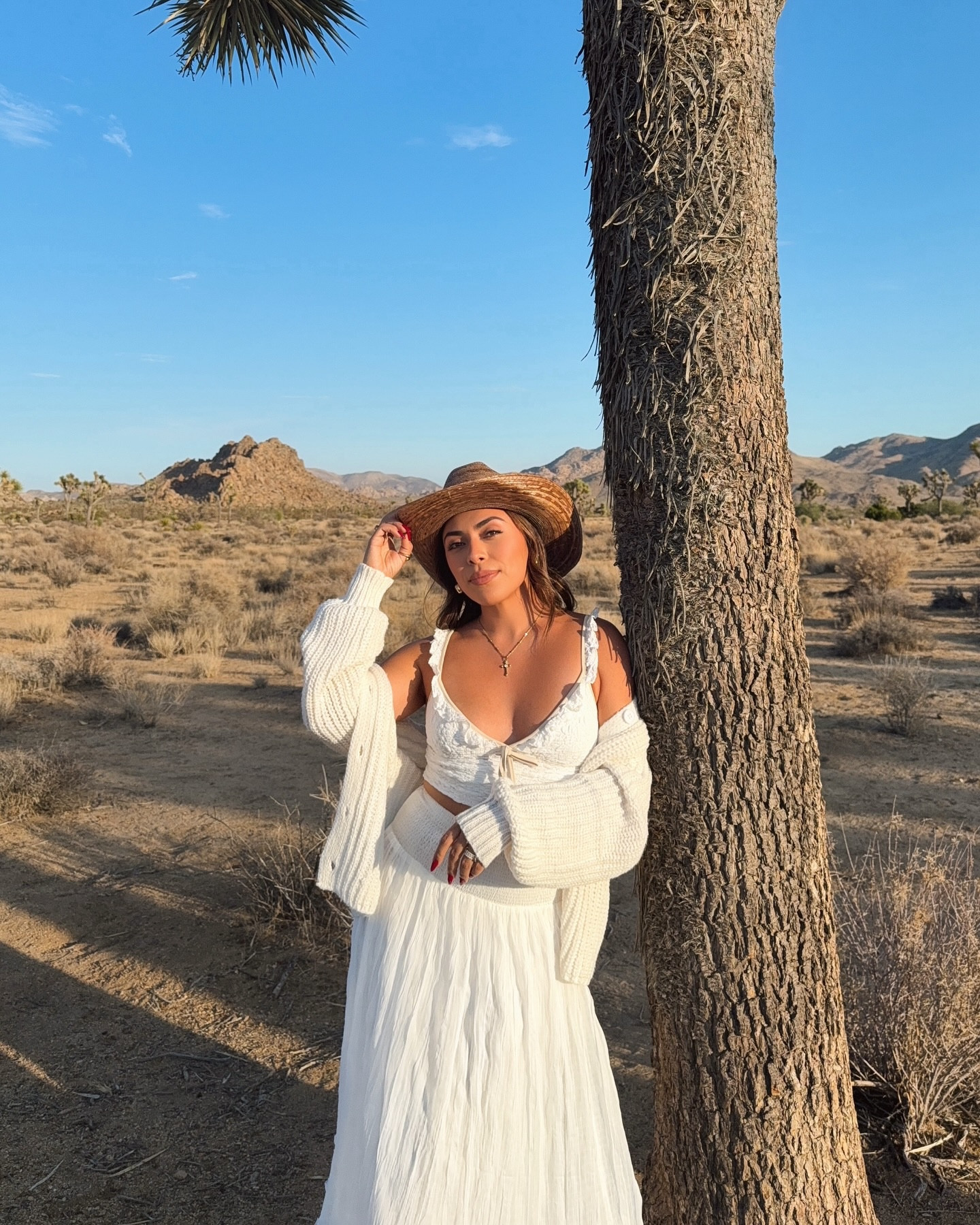 golden hour inside Joshua Tree is ✨magic✨ !!!
—
cow girl hat: @boot_barn_official 
lace top: @whitefoxboutique 
maxi skirt: @lulus 
boots: @dolcevita 
cardigan sweater: @amazonfashion 
—
maxi skirt, fall outfit, cowgirl boots, cowgirl hat, western style, fall style