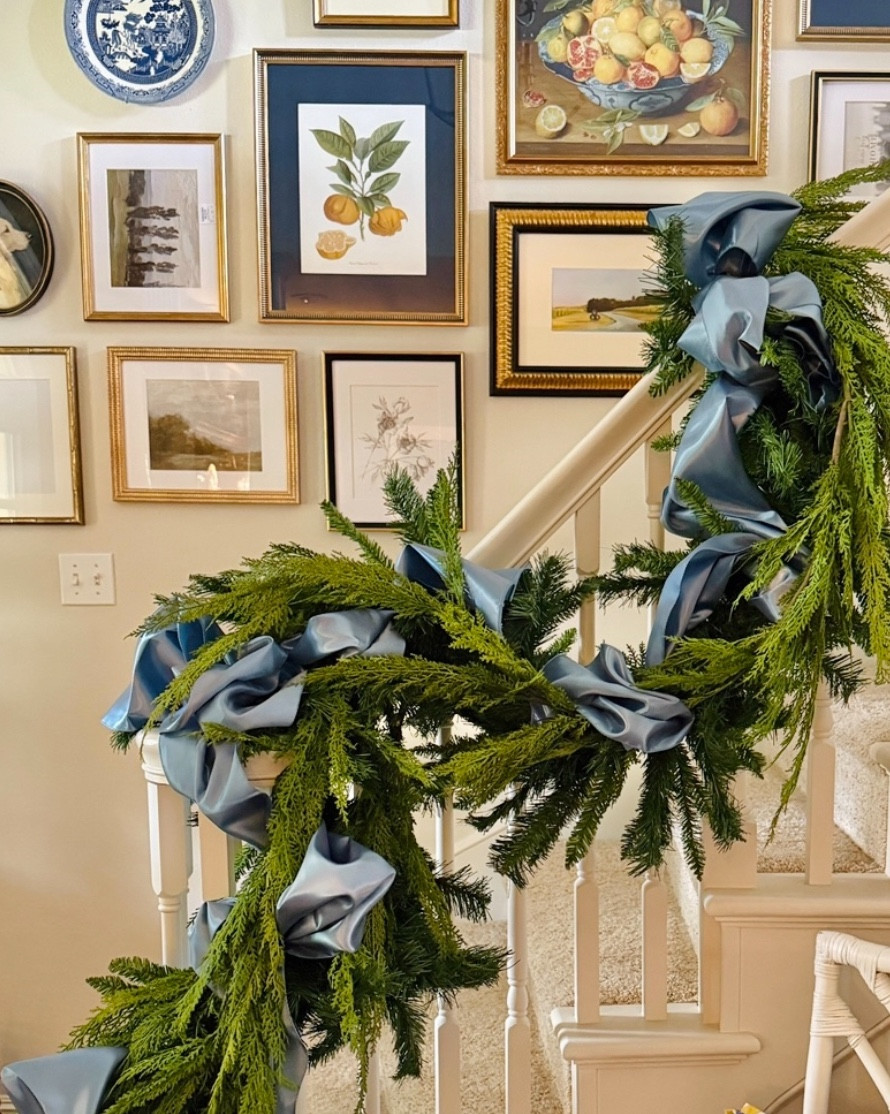 Stairway holiday garland sneak peek! I’m just getting started and plan to add more, but I wanted to show you the base of my garland so you can plan ahead for the holidays. It always seems like the garlands sell out so quickly! Here’s what I used. These are definitely higher priced than many of the garlands influencers are posting this season, but I promise they are worth it! No plastic-y garland for me!

• A PVC mixed pine garland as a base (unlit with at least 300 tips)

• Then I wrapped it in a real touch cedar garland

• The Amazon table runners in Dusty Blue are used as “ribbon”