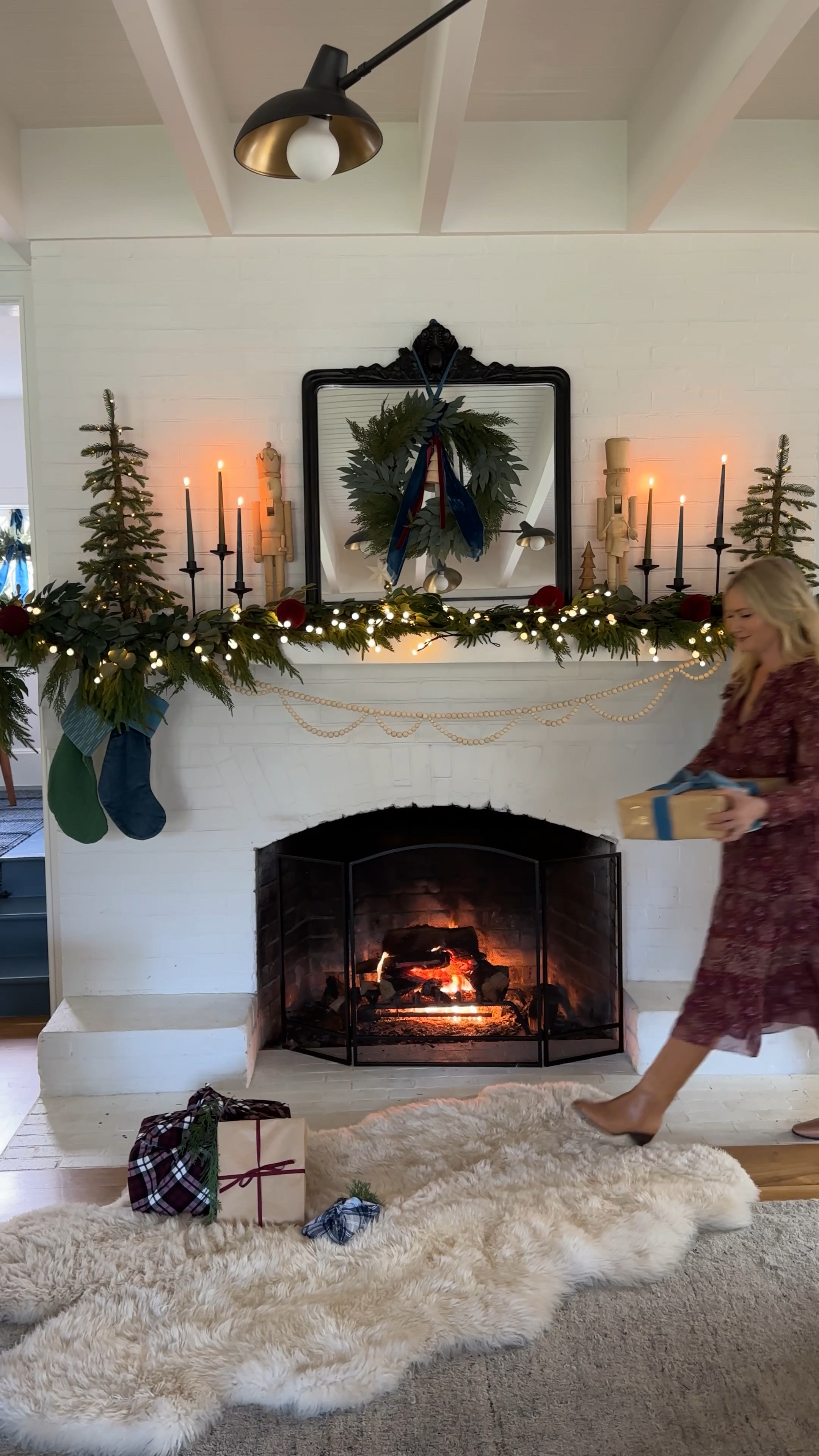 While I still want to paint the mantel a dark color (coming at you in February) I LOVE how these stockings pop off and add more life there (it was a bit cold last year). And we went big with this garland on the mantel (last year was WAYY too sparse) which I ordered from Accidental Farmgirl (IG marketing really knows me) and while it’s splurgy, I know I’ll use it for years plus it supports a small business. It’s SOOOOO full and looks pretty darn realistic. I added in these larger lights from Terrain (which plug-in, LOVE), added these little pre-lit trees, my Scandi nutcrackers, and pretty candlesticks. 

#LTKHoliday #LTKVideo #LTKhome