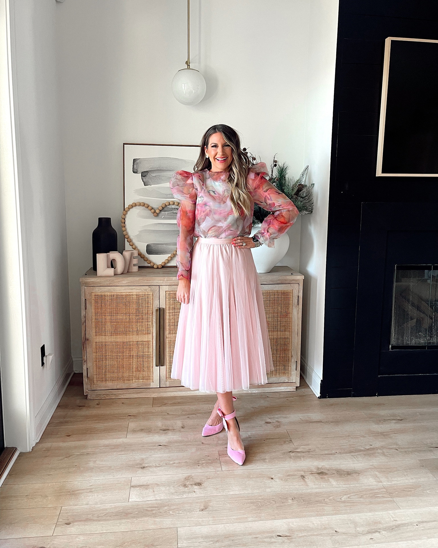 In a medium floral see-through blouse, small bodysuit underneath, one size tulle midi skirt & pink bow heels for Valentine’s Day from Amazon - all fits TTS.

#LTKunder50 #LTKSeasonal #LTKstyletip