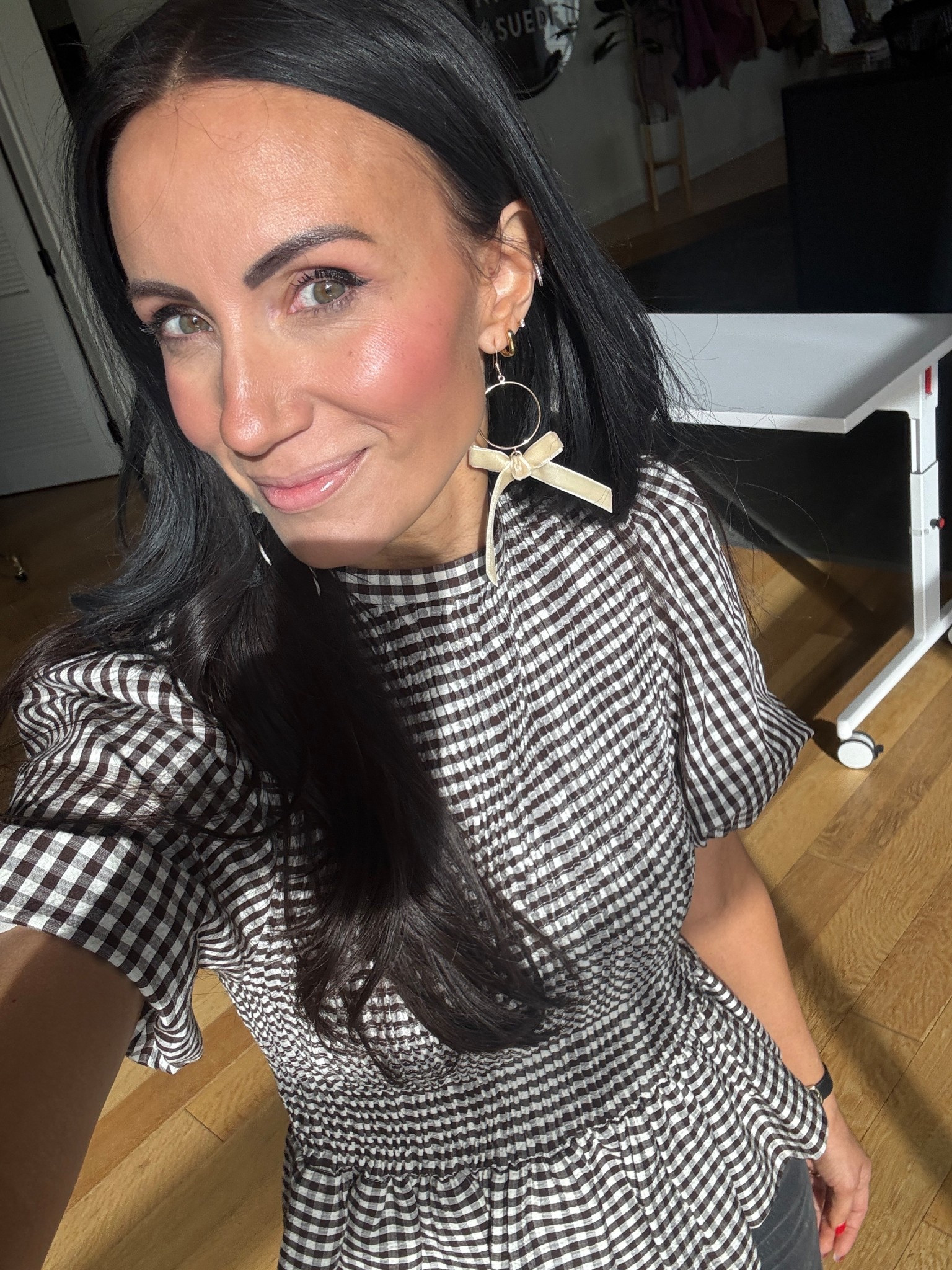 Brown gingham was everywhere in Paris shops/ this top is an affordable way to wear it. Bow statement earrings come in other colors and are super lightweight- under $40. 