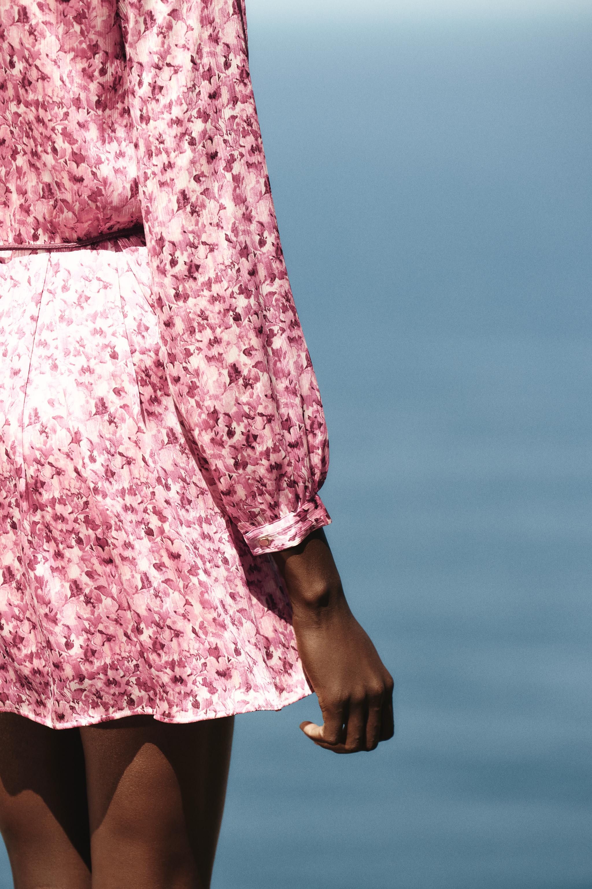 Round neck dress with a V-neckline and long sleeves. Drawstring belt detail and faux front button... | Zara US