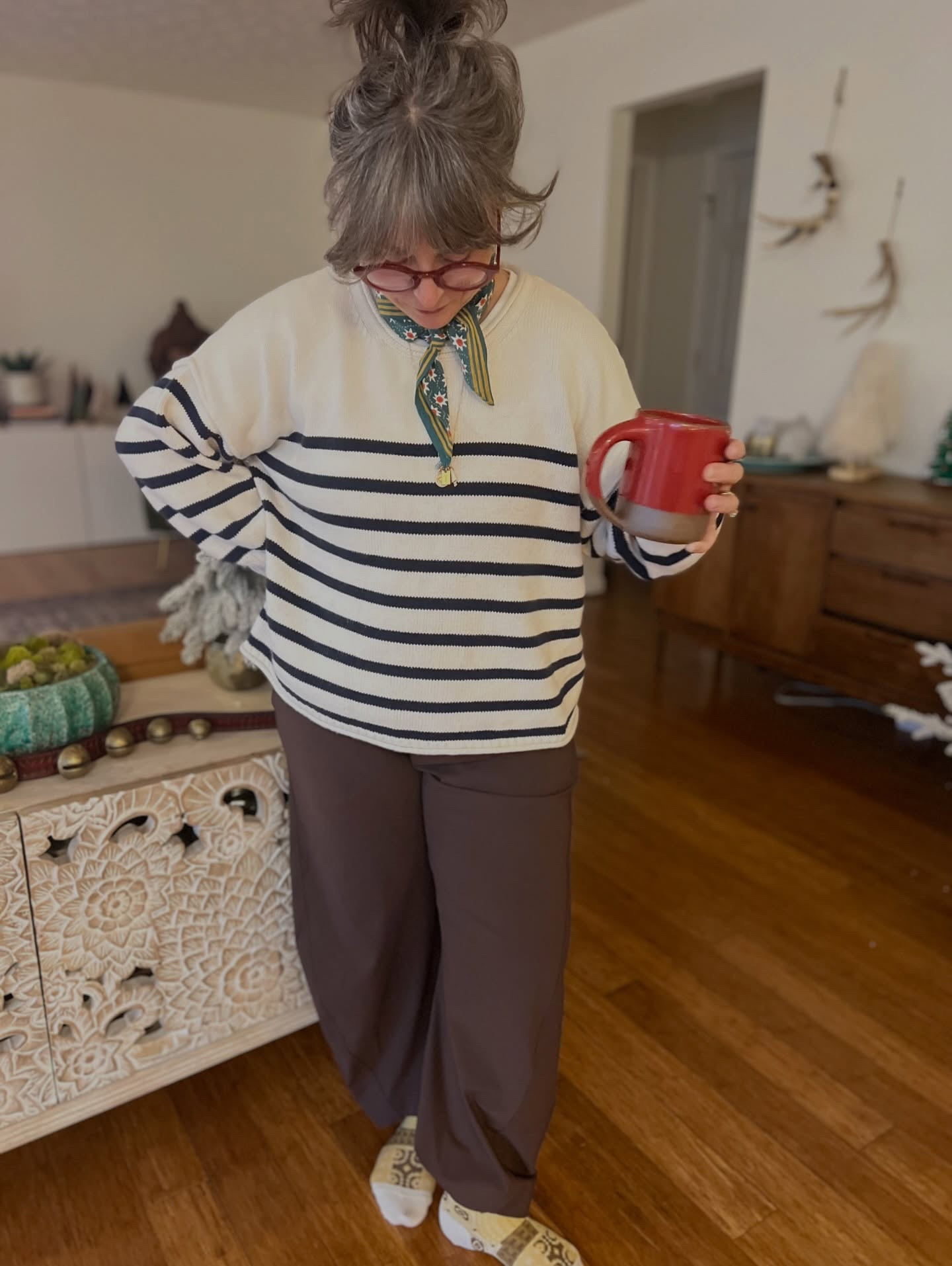 Quick fit check yesterday before we hosted family for the day. I’m at the point in the holiday season that I’m ready to kick back in my pajamas for a few days. My favorite outfit recipe lately for creating a secret pajama look is as simple as a pair of comfy athleisure style bottoms with an oversized sweater. It looks put together but it feels like pajamas. 

Pants- kindly gifted by @ruti 
Sweater- old from @madewell 
Socks- @hanselfrombasel 
Bandana - @blockshoptextiles 
Glasses- kindly gifted by @warbyparker 
Mug- @eastforkpottery