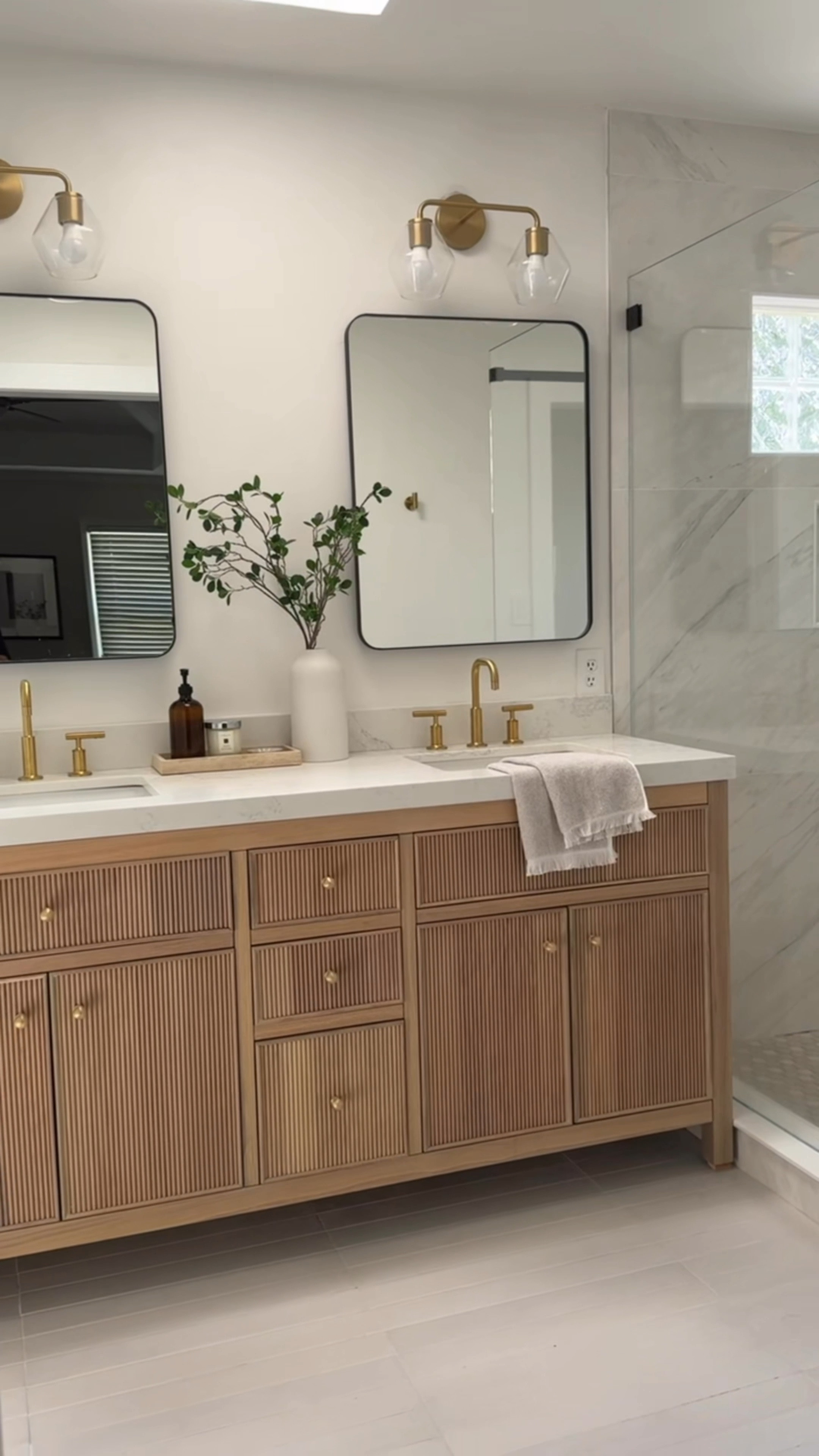 This entire beautiful bathroom is from Wayfair and they’re having a 48 hour clearance sale up to 70% off! 

We used so many affordable options, yet were able to achieve this high-end look. Love the reeded detail of this prefab wood vanity, which comes with multiple different countertop options. My favorite part could be the medicine cabinet. So stylish and functional. Love how the neutral colors of the tile provide a serene vibe.

Marble tile, large format, tile, gray tile, wood, vanity, brass faucet, brass shower system, black rectangle, mirror, medicine cabinet glass, sconces, brass, sconces, glass, shower door, sliding glass door


#LTKFindsUnder100 #LTKSaleAlert #LTKHome