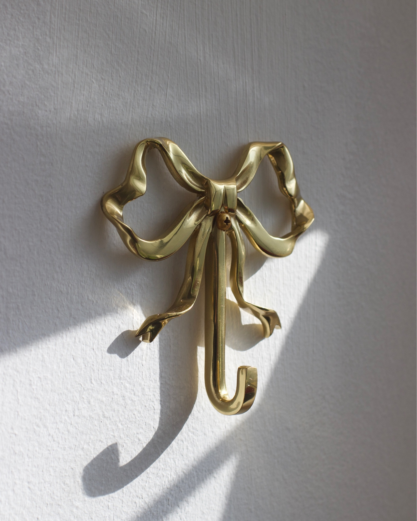 Solid brass bow / ribbon wall hook 

#LTKHoliday #LTKfindsunder50 #LTKhome