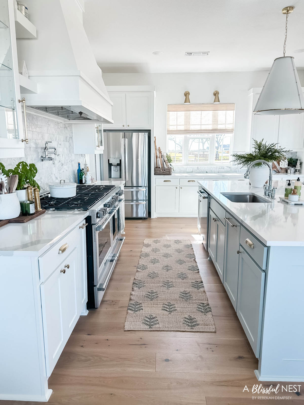 My Christmas kitchen from last year felt so bright and cozy with just a few little seasonal details.
European mill, illuminated mercury Christmas trees, Mud Pie utensil holder, wooden spoons, Christmas village houses, bamboo dish scrub brushes, Mrs. Meyer's kitchen set, artificial Norfolk pine branches, textured ribbed vase, Thymes Frasier Fir candle, white and wood cutting board, round cutting board 

 #LTKHoliday #LTKSeasonal #LTKHome