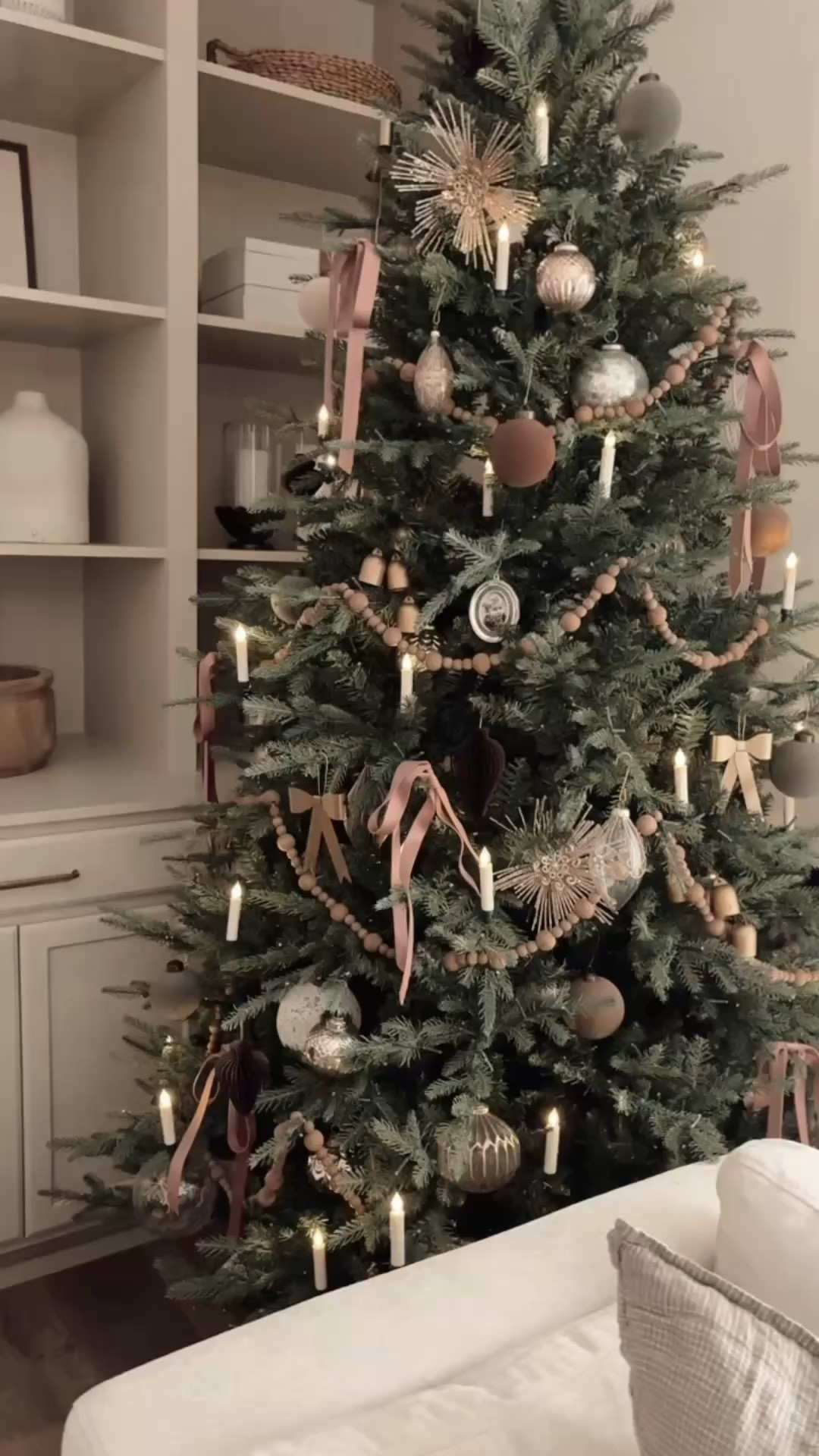 I added these battery operated candles to our Christmas tree last year and it made it so magical. They come with a remote which makes it so easy to turn them on and off. They are pretty with the tree lights on or off. They just clip on the branches and you can easily straighten the candle part out.

#LTKHome #LTKSeasonal
