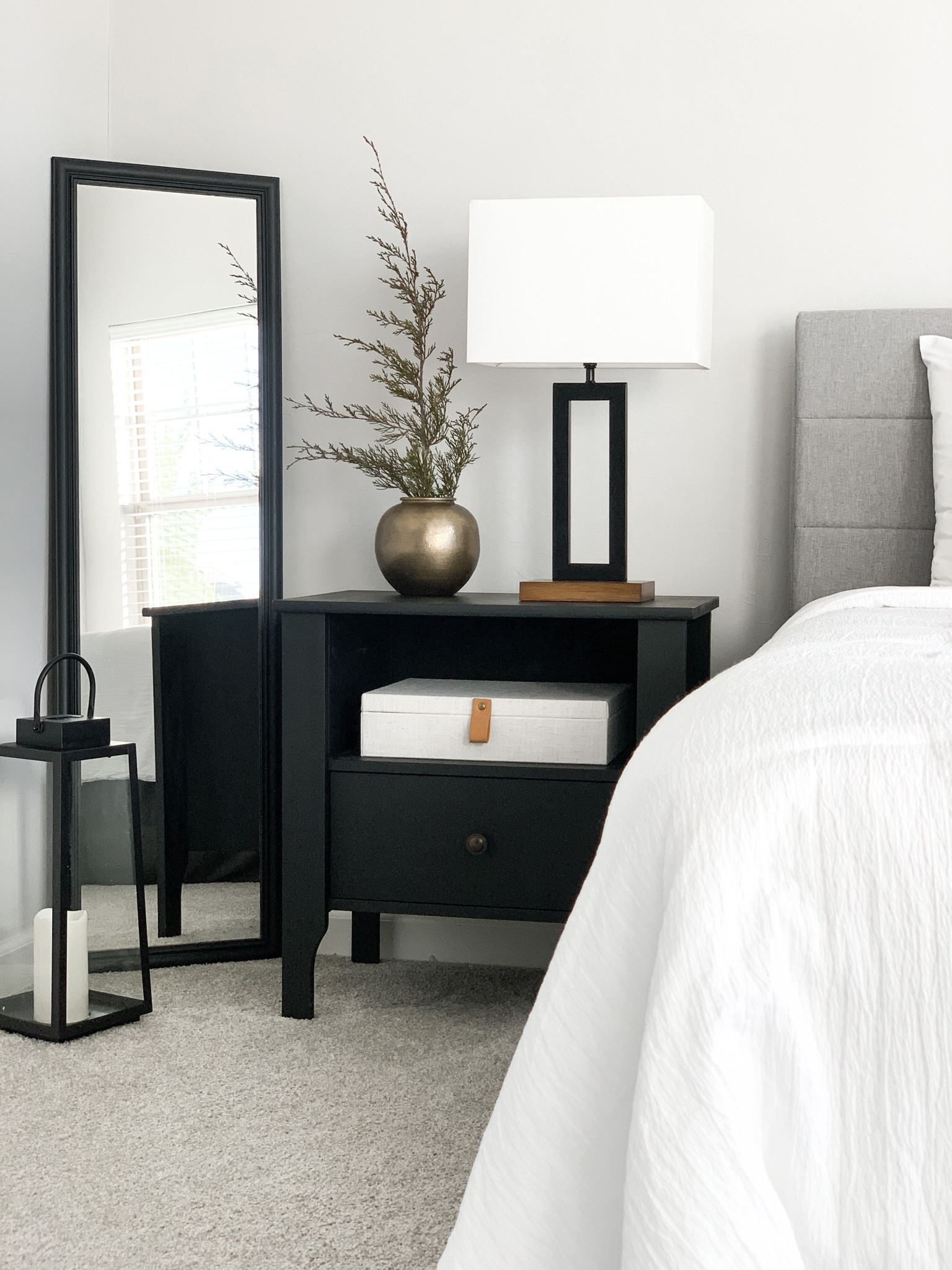 Modern minimal bedroom 

Home decor, bedroom decor, black nightstand, black mirror, decor box, lantern, nightstand lamp, nightstand decor, vase, white bedding, upholstered headboard, bed styling, bedroom styling, metal wallart

#LTKFind #LTKstyletip #LTKhome