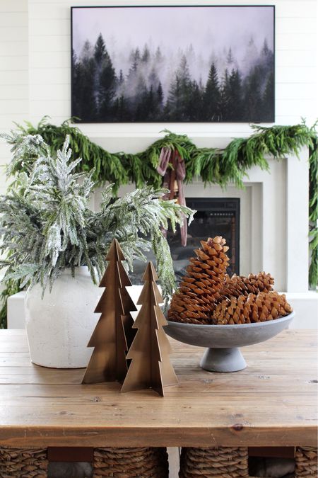 Coffee table, Christmas trees, bowl, oversized pine cones, Norfolk stems, vase, Norfolk garland 

#LTKSeasonal #LTKHoliday #LTKhome