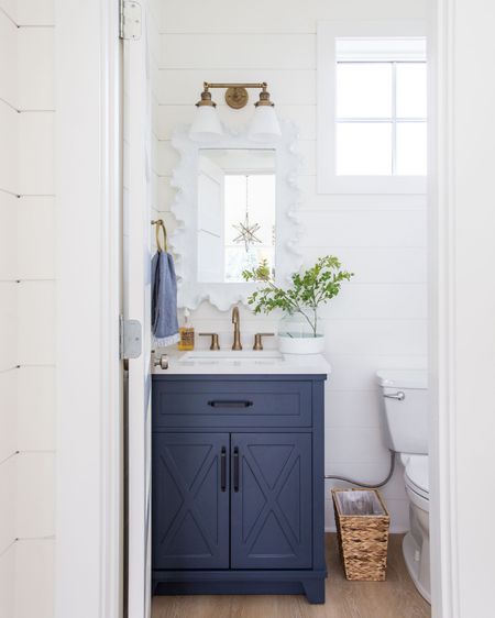 Our Omaha pool house bathroom featuring a navy blue vanity, white coral style mirror, gold fixtures, paint dipped vase, seagrass wastebasket and costal touches! 
. 
Amazon finds, kids bathroom decor, poolhouse bath, preppy bathroom decor

#ltkhome #ltksalealert #ltkstyletip #ltkunder50 #ltkunder100 #ltkseasonal #ltkfind #LTKhome #LTKsalealert #LTKhome

#LTKSaleAlert #LTKHome #LTKSeasonal