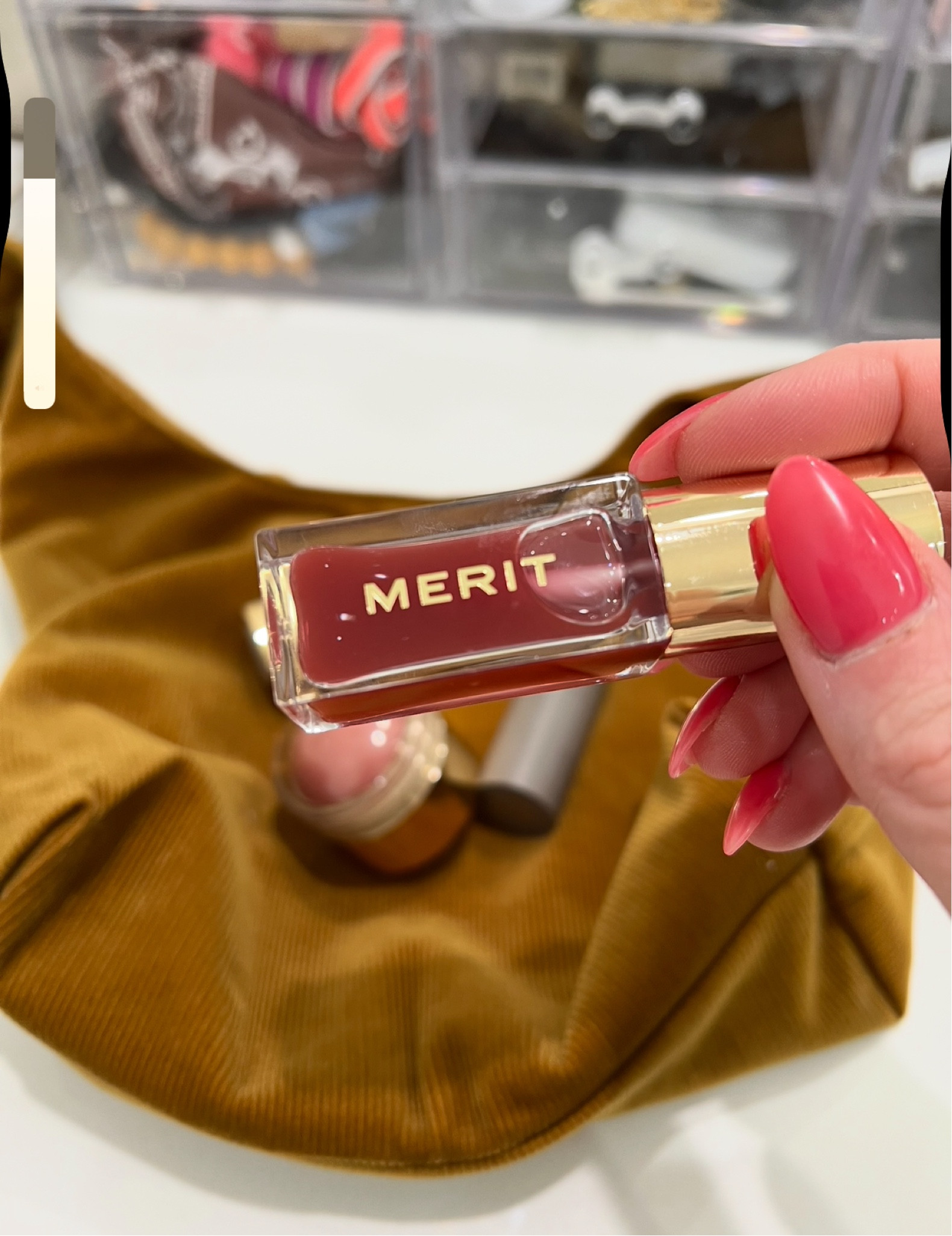 I love Merit Beauty- this lip oil is not sticky and such a pretty color 