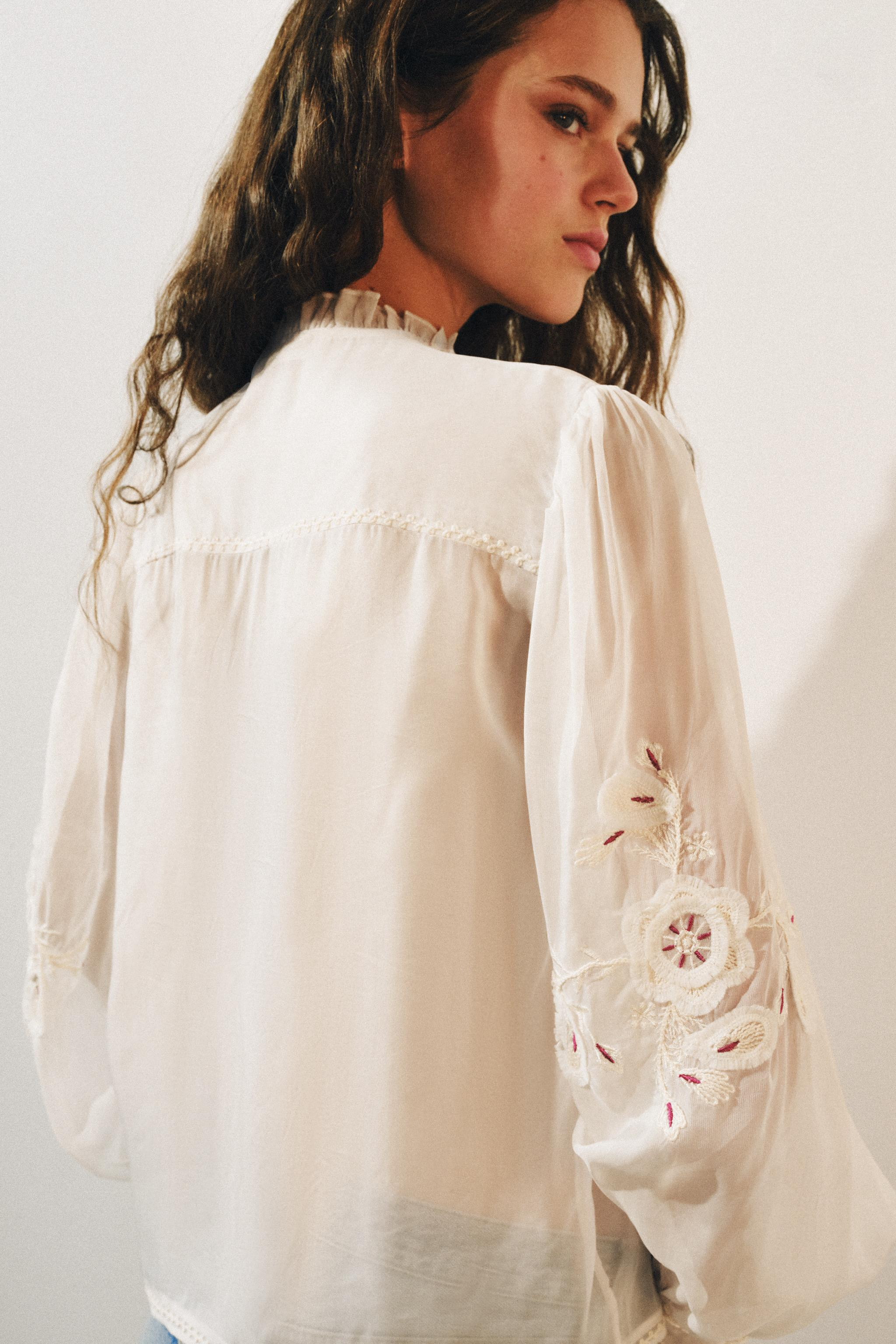 ZARA WOMAN COLLECTIONShirt with main fabric made of viscose yarn. High collar with V-neckline and... | Zara US