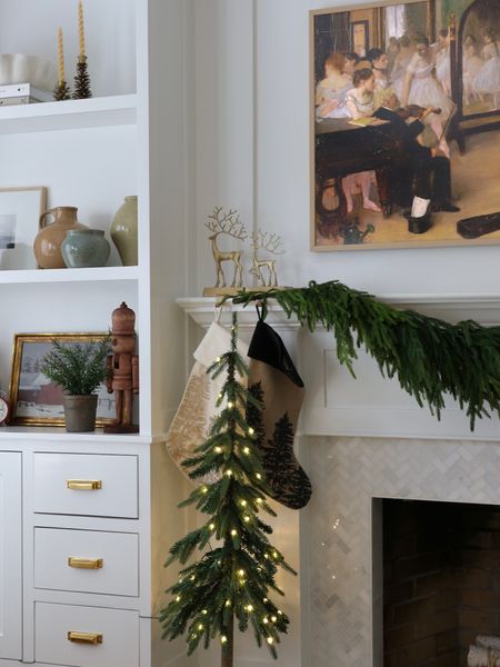 Christmas, Christmas decor, Norfolk pine garland, Christmas tree, Christmas stocking, stocking holder, wood nutcracker, pine cone taper holder

#LTKhome #LTKstyletip #LTKHoliday