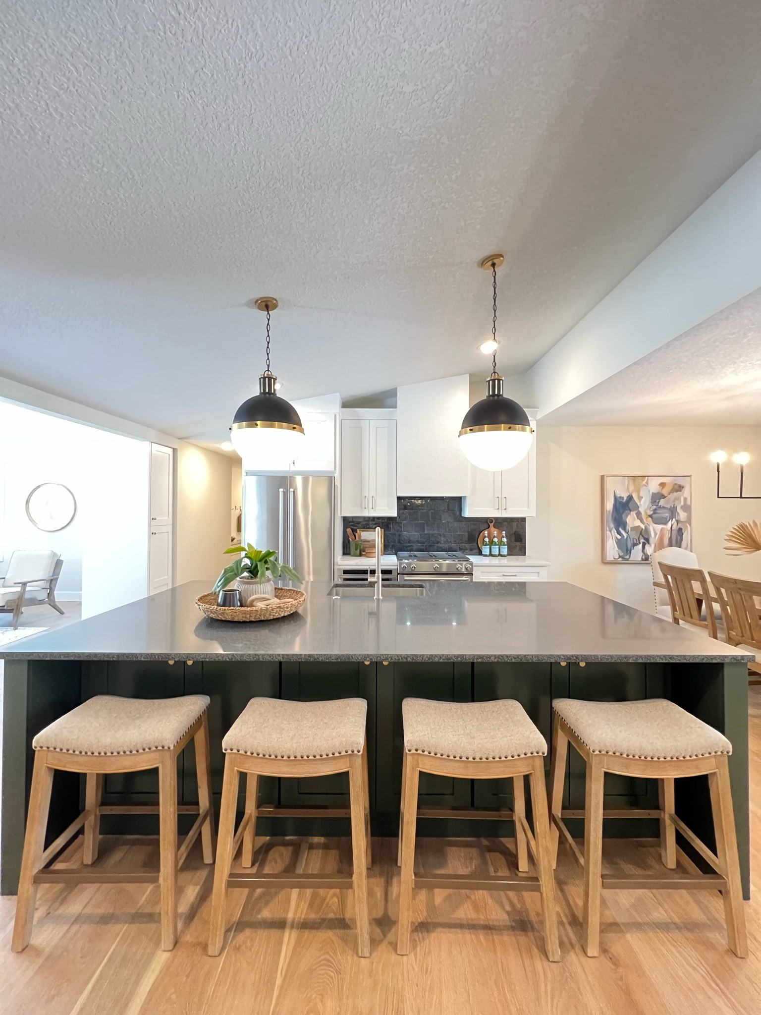 Love the idea of a classic kitchen but want to go in a different direction?  Consider a bold pendant and a contrasting island.  Adding black as the accent in the backsplash, lighting and countertop balances the space for warm and organic details to create a truly unique space worthy of the “heart of the home” title. 

#LTKstyletip #LTKhome #LTKsalealert