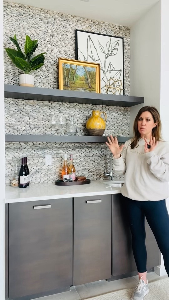 Jazz hands for built-in bars! 🤪 We had a fun project styling a brand new, modern home with a fabulous built-in bar as part of the grand living room. The challenge was to style it so it can be beautiful for everyday use, while still showing its primary function. (When entertaining, bringing out all the spirits and glassware definitely makes it festive.) Here’s how we did it! 🍷🍾
Wall art, leaner art, botanical art, black and white art, landscapes, decorative accessories, barware, glassware, wine glasses, cocktails, bar, living room bar, bar styling, shelf styling, ceramics, yellow accessories, Target, cb2, Amazon, Pottery Barn, Magnolia

#LTKVideo #LTKhome #LTKstyletip