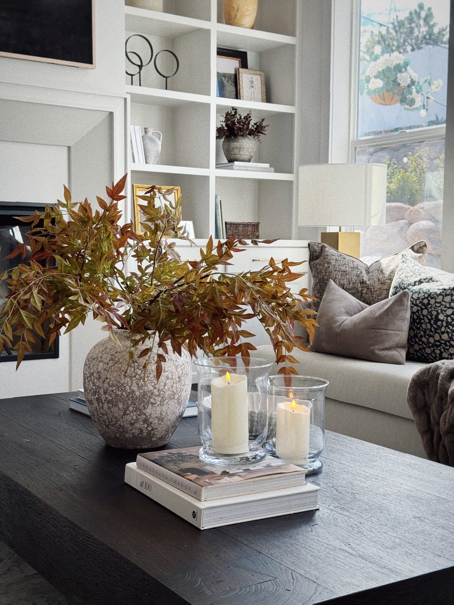Autumn styling, but make it easy 🍂

A few warm branches, layered coffee table books, and candlelight are all it takes to make a space feel cozy for fall without going overboard. I love keeping the base neutral and letting those rich rust + olive tones do the seasonal work.

Simple, warm, collected—the kind of fall decor that can stay up all season. 🤎