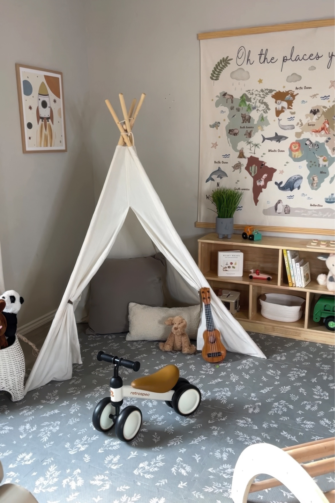 Playroom ideas with an oversized map, tepee tent, leaf patterned play mat, and natural wood bookshelf 

#LTKHome