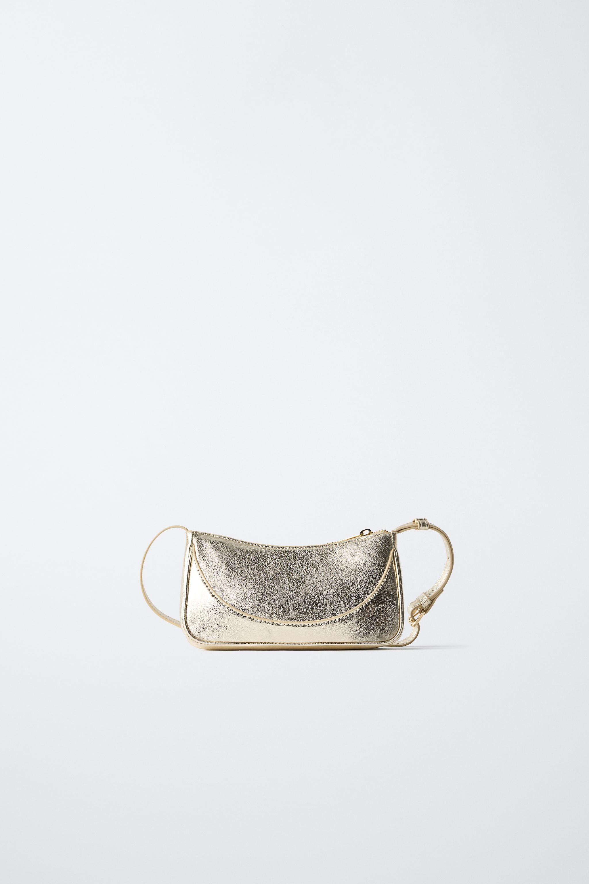 Crossbody bag with a metallic finish. It features a main compartment with a zip closure and an ad... | Zara UK
