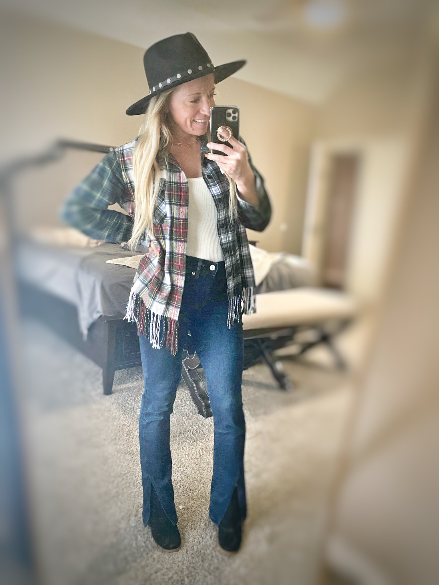 Thanksgiving outfit 🦃🍁 #ootd
My jeans are currently on sale 50% off! Absolutely love them fit is perfection and they are soft and comfy almost with a little stretch. Front vent skyscraper dark wash jeans sz 0 short. Express Black Friday sale everything 50% off 
Also loving this plaid fringed shirt  from rent the runway so comfy and not too thick but still warm for a chilly day 😍 wearing sz XS 
Hat is from Walmart 😃 
Linking some great alternatives to my Steve Madden wedge booties (I’ve had them a couple years now) also great prices! 

Split hem split front jeans 
Shacket fringe 
Wide brim black western hat 
Black boots booties winter outfit 

#LTKHoliday #LTKsalealert #LTKGiftGuide