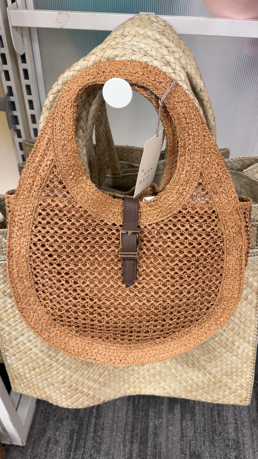Easy summer accessory! ✔️ This Straw Oval Shoulder Bag from A New Day at Target is such a good warm-weather find. 🌞 The oval shape feels a little more elevated than your typical straw tote, and it pairs perfectly with sundresses, linen sets, or swim coverups. Lightweight, neutral, and so easy to style for vacations or everyday summer errands. Linked this one and a few other cute seasonal bags! 🤎 #SummerAccessories #StrawBag #VacationOutfit 

#LTKSeasonal #LTKSaleAlert #LTKootd