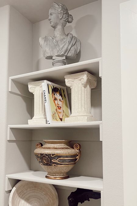 one of my favorite spots in the new house! ✨🏛️

home decor, greek statues, decor books, vases, candle sticks, decor for shelves, new house inspo, new decor inspo, chanel book, prada book, gucci book

#LTKhome