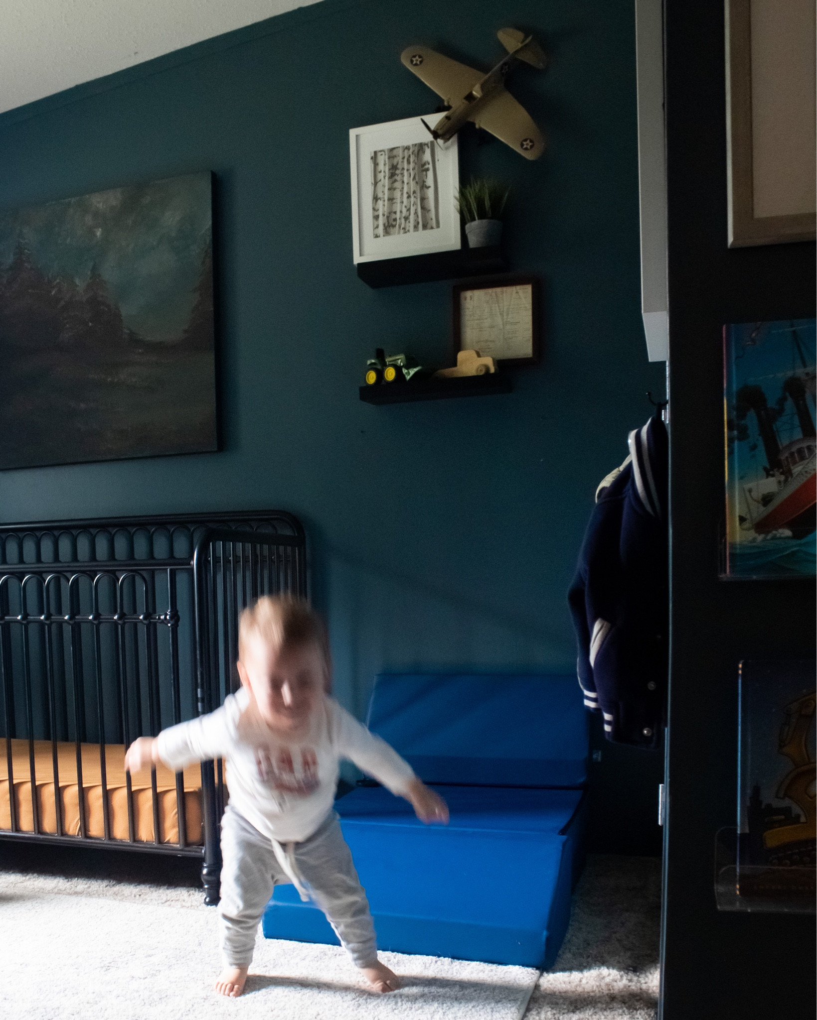 Navy blue nursery. Dark and moody blue boy nursery. Traditional baby nursery. Metal crib. Landscape art. Play furniture 

Walls are SW Rain Cloud
Art is a DIY- linked similar 

#LTKfamily #LTKbaby #LTKhome