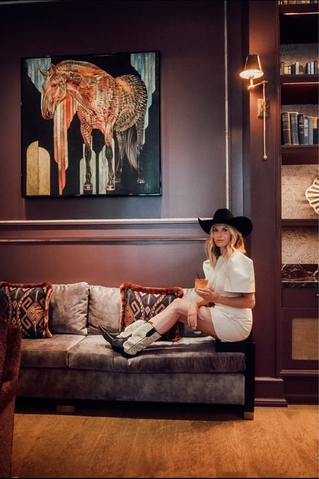 Fort Worth style 🤠 beige asymmetric mini dress, Isabel Marant cowgirl boots and black felt cowgirl hat  

#LTKSeasonal #LTKstyletip