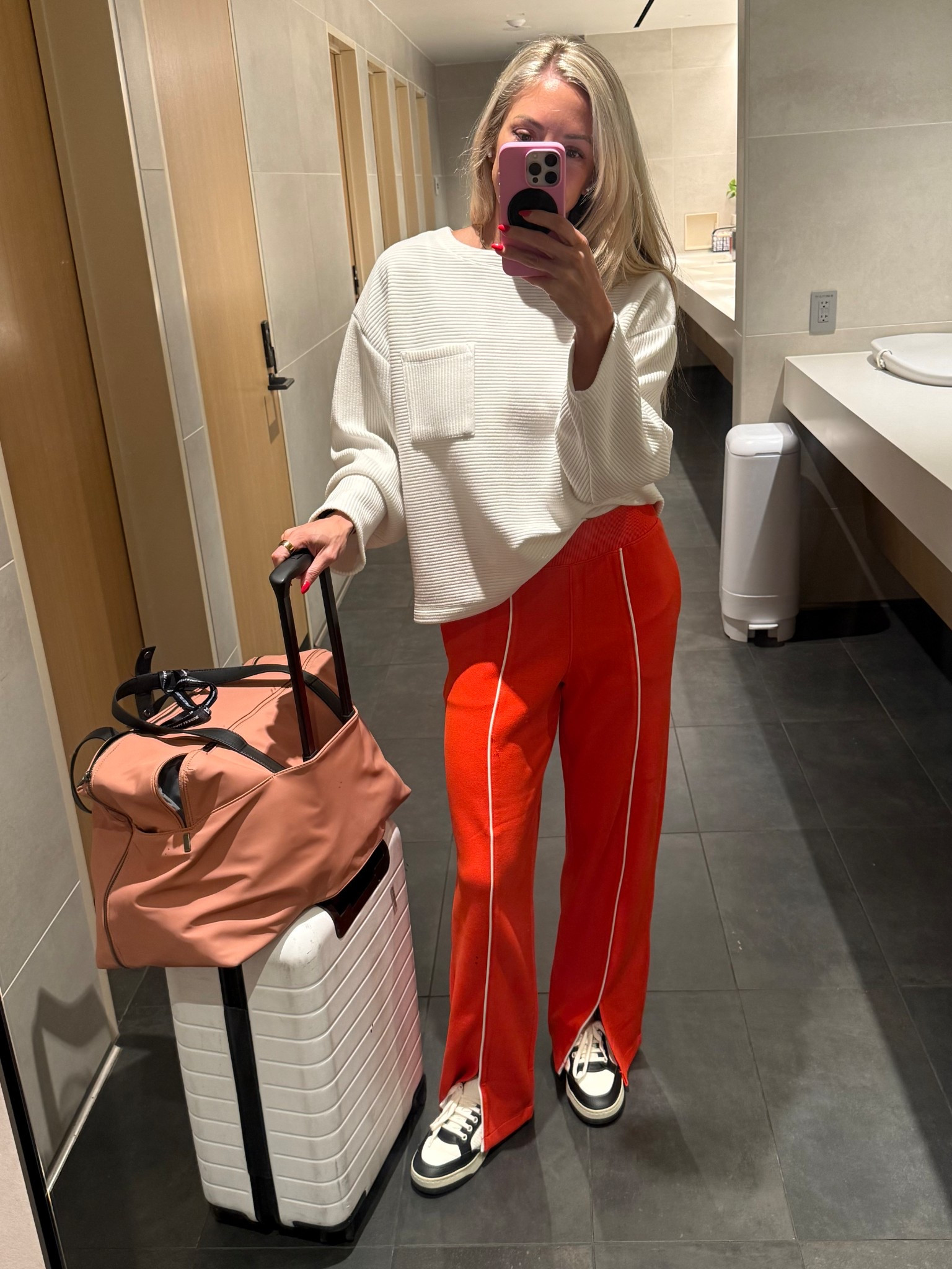 Travel day comfy clothes 

Pants are Spanx and on major sale - come in 3 different colors  

I swear by the away bigger carry on & the large everywhere bag

I am Team Carry On because of both of these bags! The pink-ish one is the “personal” size bag and can fit under seat, even when it’s completely stuffed.

And I choose the bigger carry on without the flex zipper because I don’t want it to be able to get so big that it stops fitting in the overhead. 

I loveeeee Away bags. They have been the absolute best I’ve ever had  