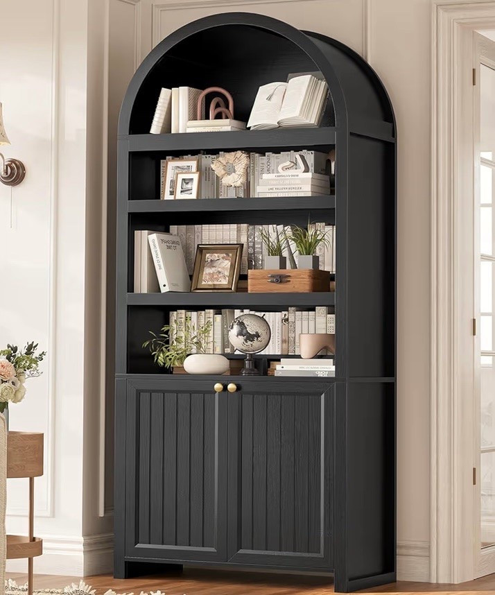 Towering at 81" Height with a 15.7" depth, this beautiful arched bookcase is not only a statement piece but compliments any decor style. Love the soft close doors and storage below to organize your belongings.

#LTKHome #LTKmomlife