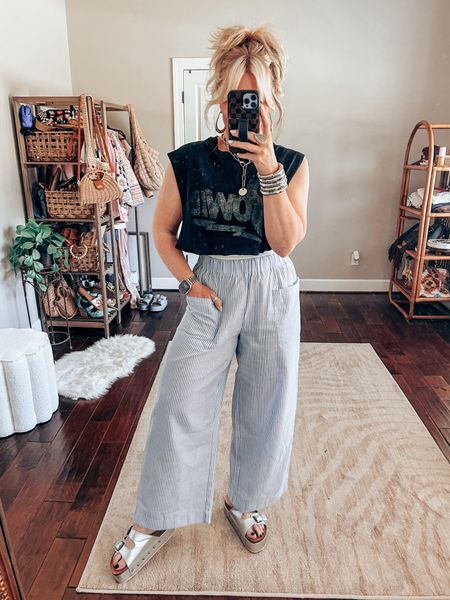 Graphic tee size L
Pants sized up to a L
Sandals true to size 
Twisted silver necklace save with code MANDIE15 
Earrings are @shopbeljoy save with code MANDIE25 


#LTKstyletip #LTKover40 #LTKfindsunder50
