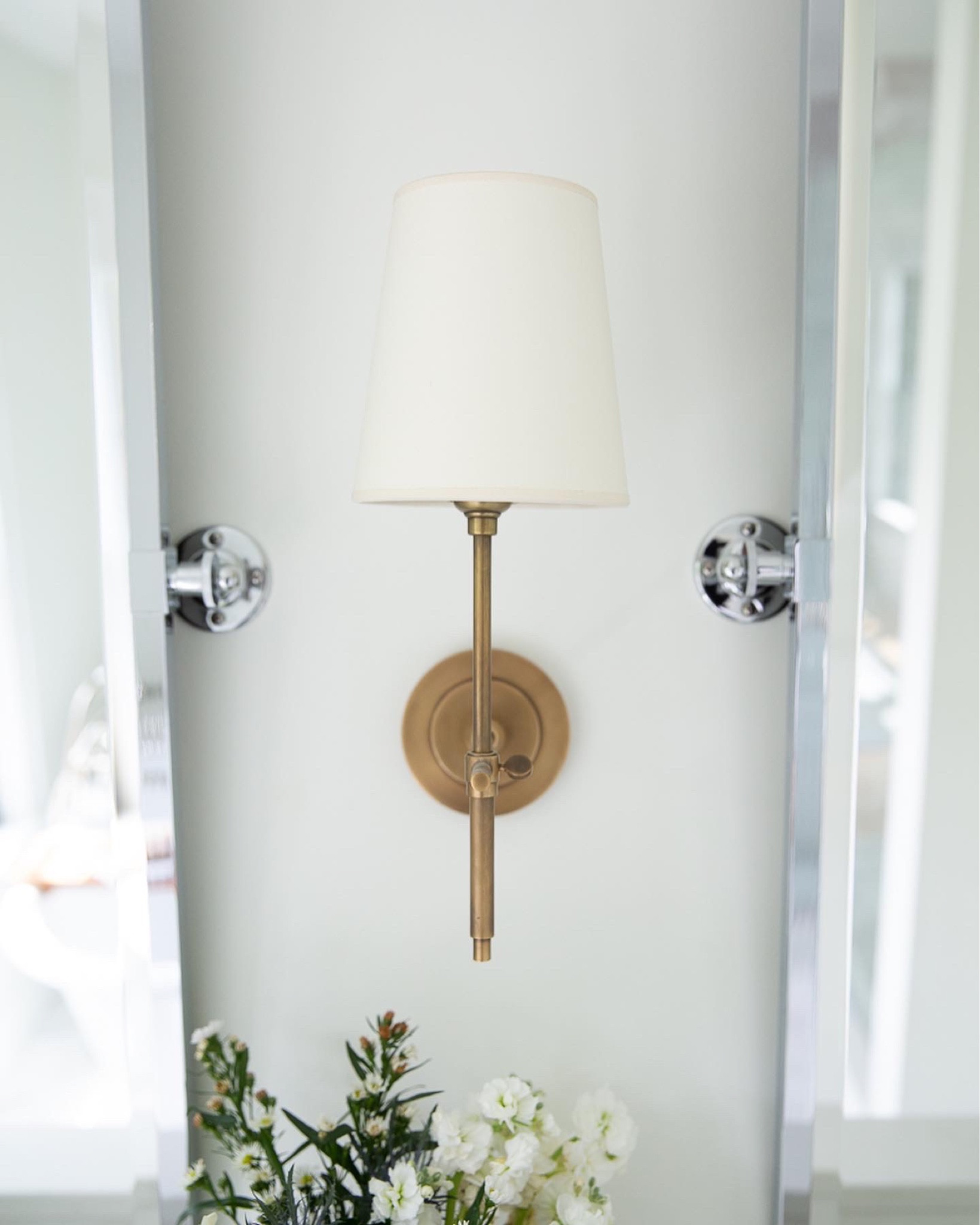 Brass sconce and chrome pivot mirror, bathroom mirror, bathroom lighting, mixed metals, tilt mirror, bathroom design 