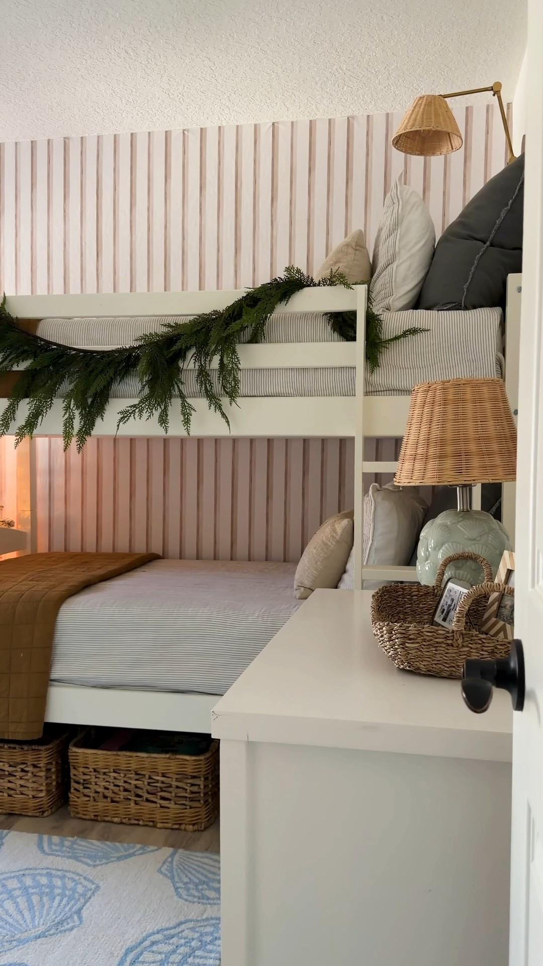 Our coastal bunk room. I linked what I could 🎄🐚✨

Also I have a discount code for the woven wood shades. Use code HOMEOFUANDME5 for an extra 5% off on top of any current sales 
Here’s exactly what I ordered from @selectblinds:
• Elevated Coastal Woven Wood Shades
• Color: Serenity Sand
• Mount Type: Inside
• Lift Style: Cordless Lift
• Valance: 6” Valance
• Built-in No-Drill design
