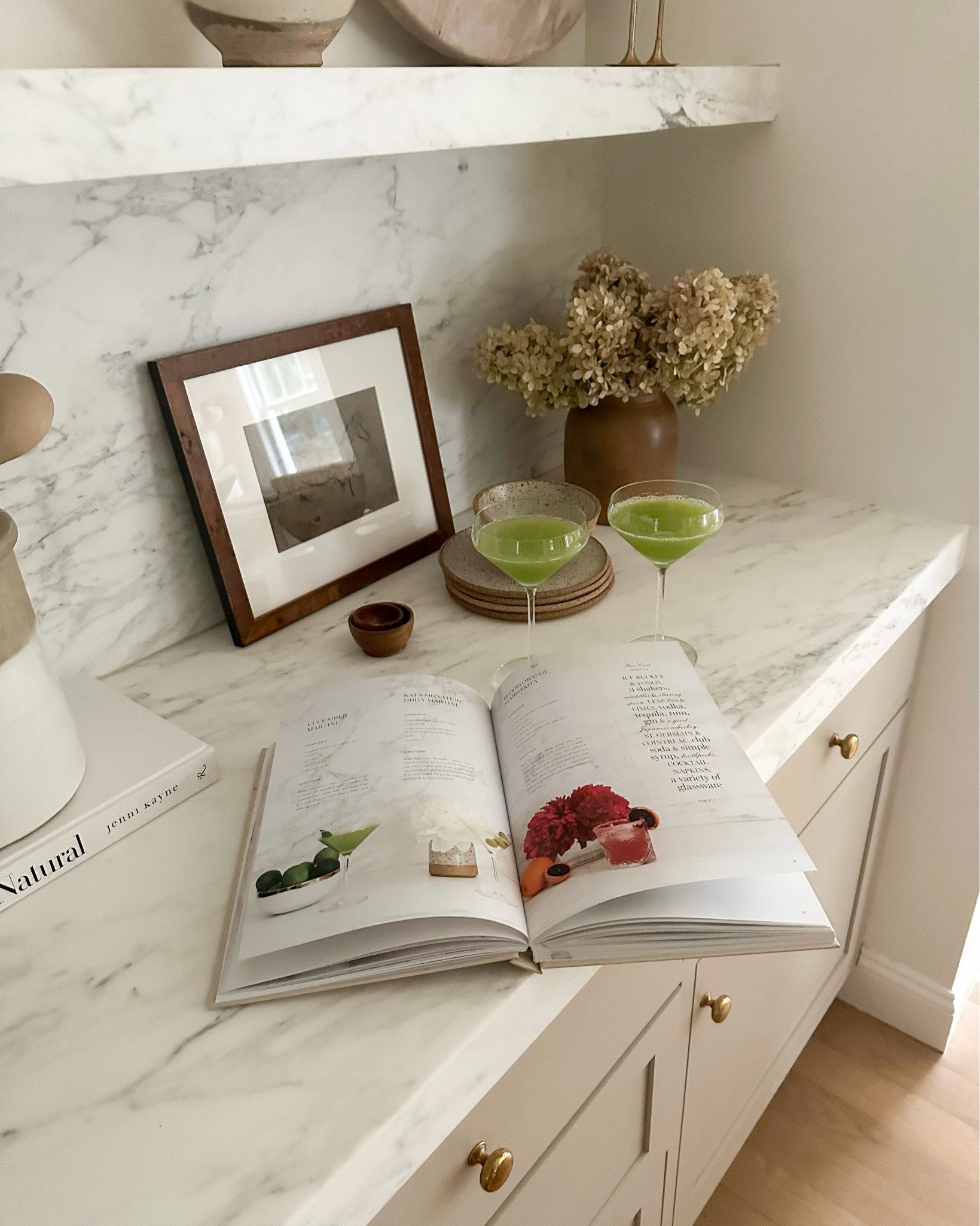 Kat Jamieson shares cucumber martinis from her book available at theblendedbook.com. Blended cookbook, healthy recipes, cocktails, martini glass, kitchen, home decor, cooking, farmhouse kitchen. 

#LTKparties #LTKSeasonal #LTKhome