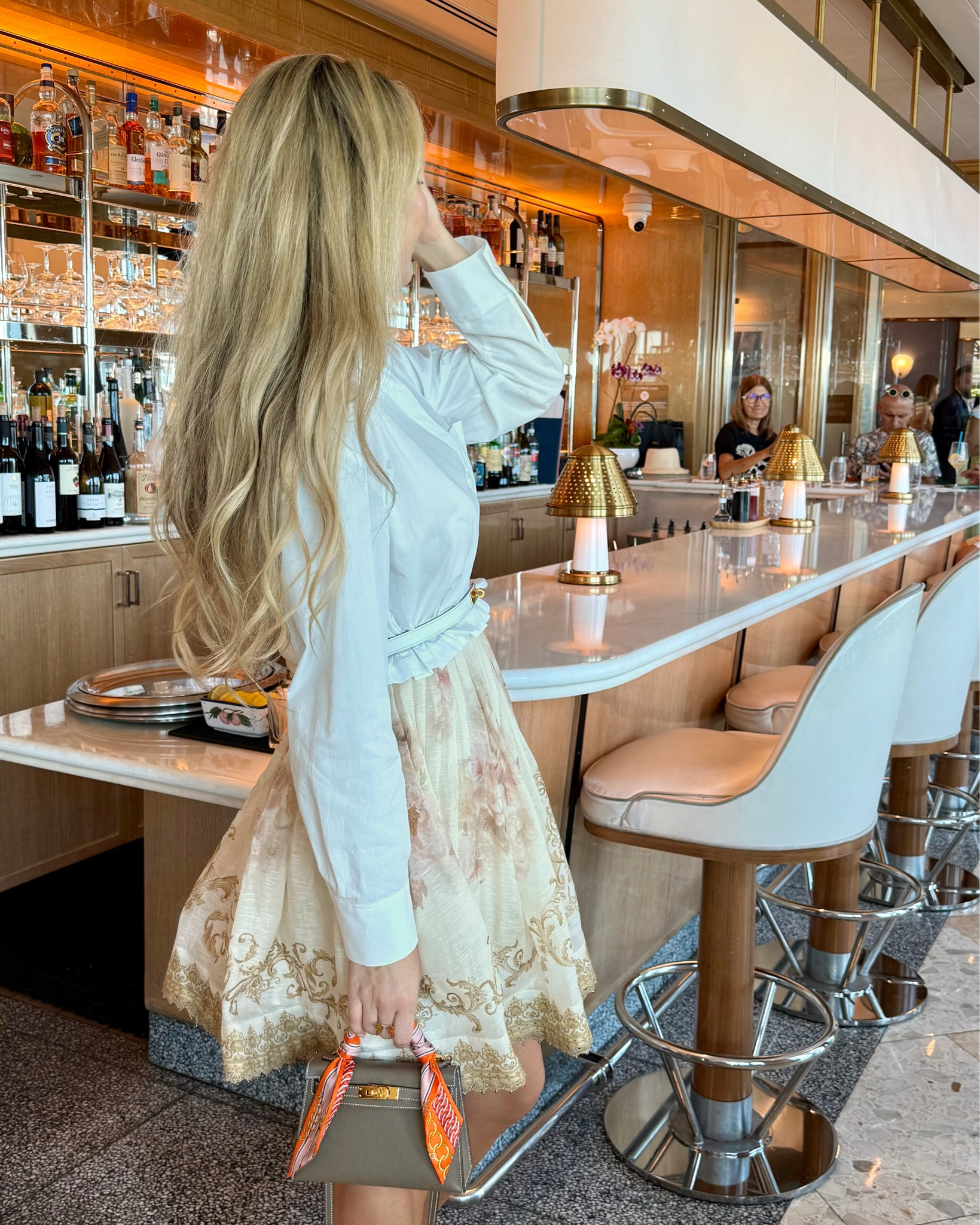 Styling a dress like a skirt - by putting a cropped shirt on top of it. The ultimate hack to ”dress down/make a revealing dress a bit more casual” for a daytime outing. Wearing my favorite white wedges to pick up the white colors of the shirt and belt. Ready for a chic girls lunch! 🤍

#LTKShoeCrush #LTKStyleTip #LTKParties