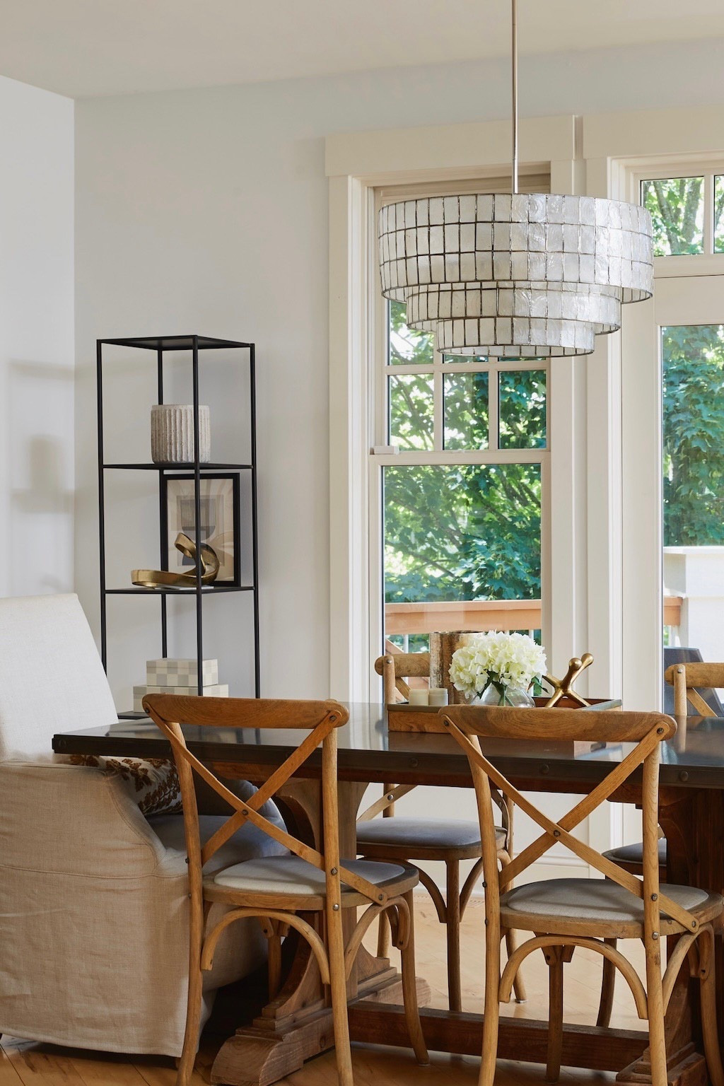 Things I love in my dining room: bistro-inspired dining chairs with cream upholstered end chairs. Statement lighting brought to you by my Capiz tiered chandelier from West Elm. And my dining table with a Zinc top.

#LTKHome #LTKSaleAlert