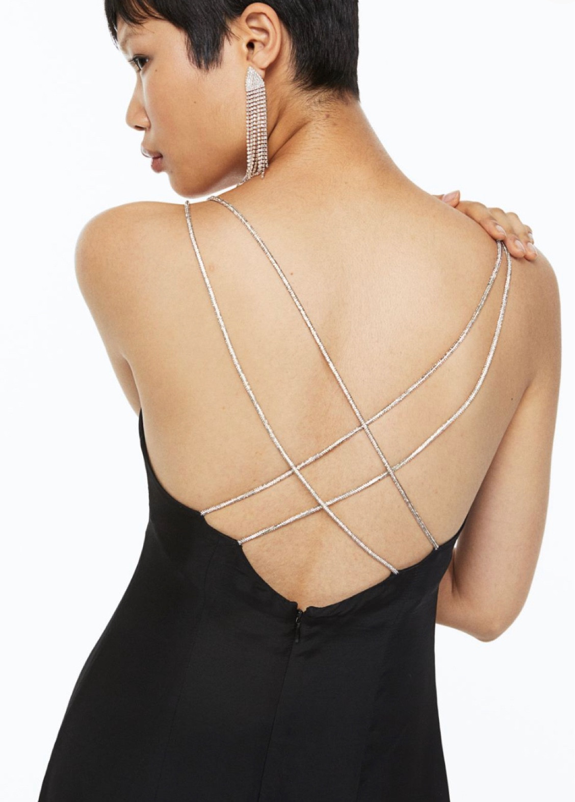 Rhinestone strap satin dress
Calf-length dress in softly draping satin with a fitted bodice and a gently flared skirt. V-neck and double, narrow shoulder straps in rhinestone chain that cross at the back. Concealed zip at the back with a hook-and-eye fastener. Lined bust with a seam underneath. High slit at the back. Unlined.



#LTKeurope #LTKFind #LTKstyletip