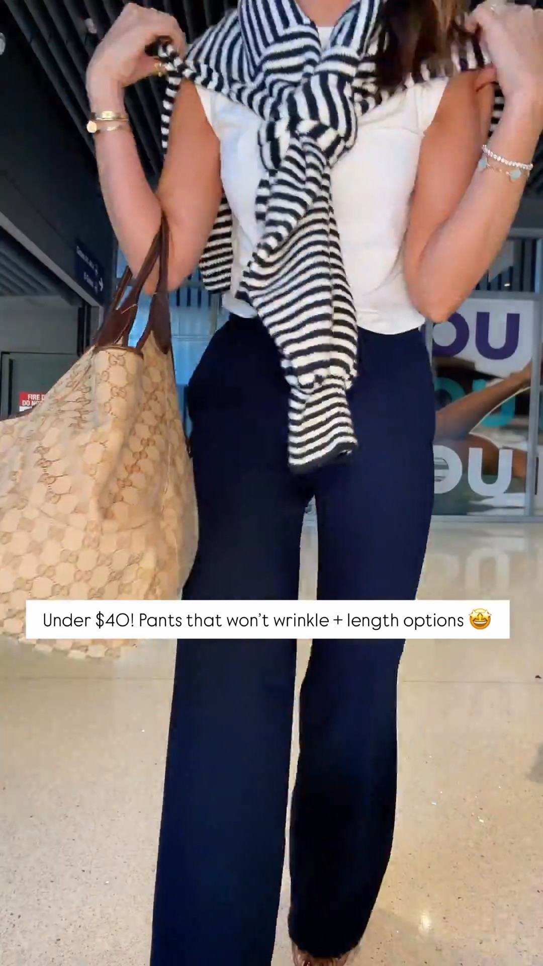 Amazon pants that won’t wrinkle in XS petite, color ‘admiral’. My travel outfit of the day! White t-shirt in XS. Striped navy sweater in small. Airport outfit. Casual outfit. Everyday outfit. Fall outfit. Teacher outfit. Business casual pants. Workwear pants.