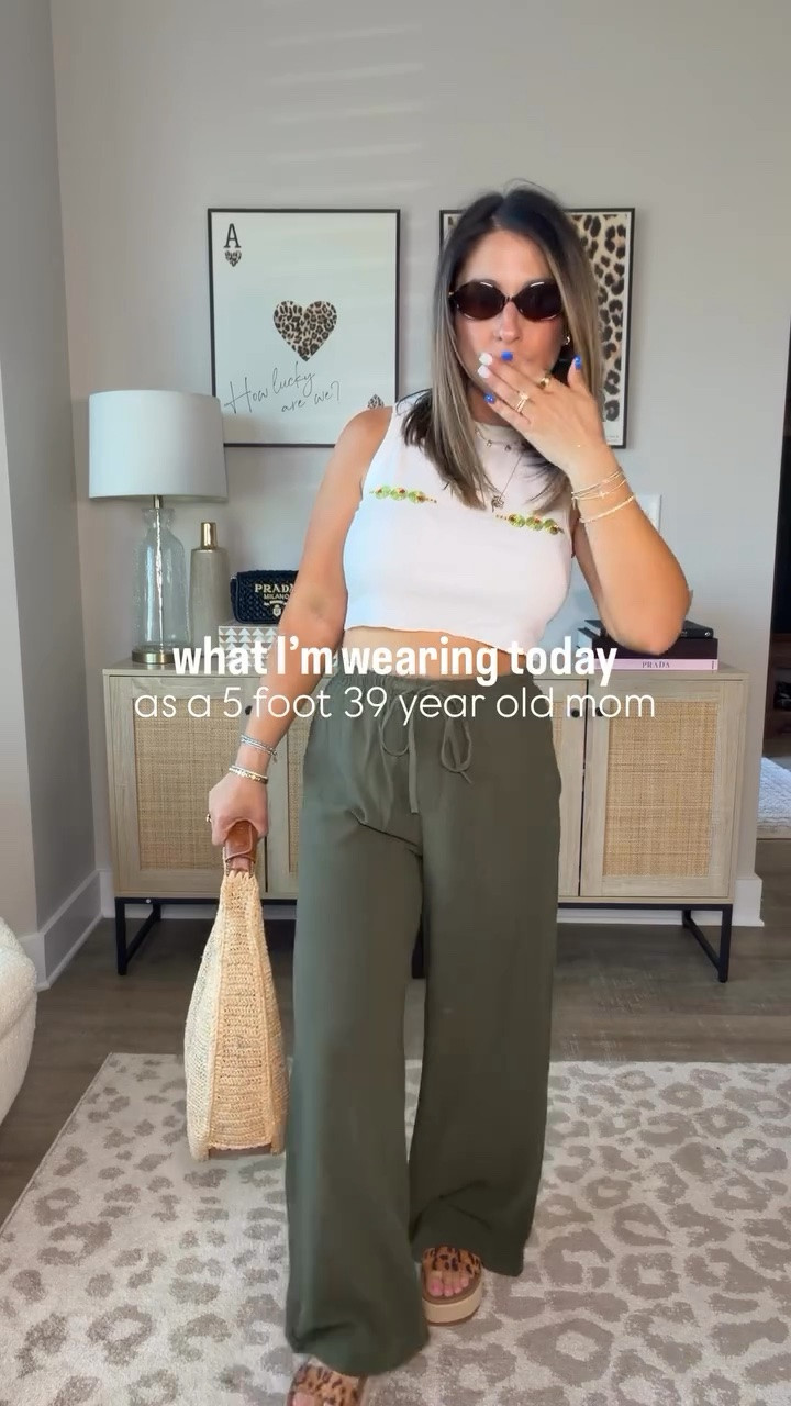 Can you tell that I’m feeling myself in this casual summer outfit?! This cropped white beaded olive tank top looks like it came from a little boutique and paired with this short girl approved summer pants is such a cute vibe. I can’t believe the price of these leopard platform sandals from Reef. 
Cool mom outfit inspo, petite friendly wide leg olive green summer pants

#LTKMidsize #LTKPetite #LTKSeasonal