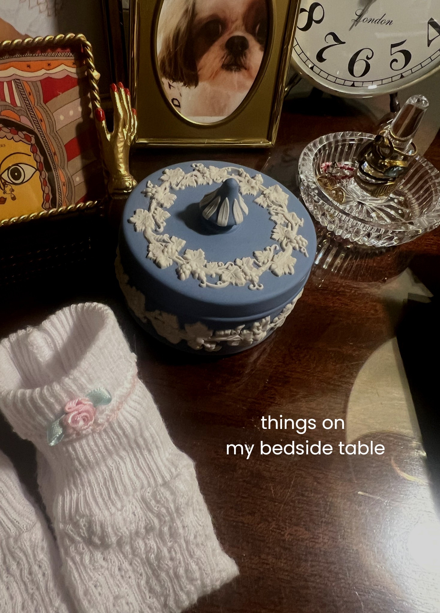 things on my bedside table : pictures and little keepsakes and tiny paty socks with rosettes, not pictured paci

#LTKHome #LTKStyleTip #LTKBaby