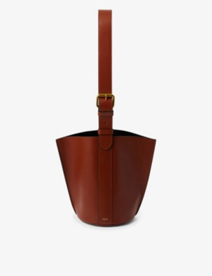 Saudade logo-embossed leather shoulder bag | Selfridges