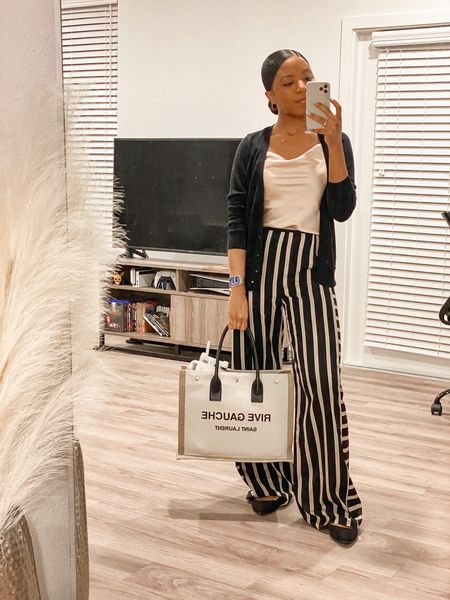 Todays work outfit featuring a style staple if you have short legs: vertical striped pants! They elongate your figure to add a bit of length on their own, but you can also tuck in a blouse to also define your waist. Paired with my new go-to work tote from Saint Laurent  

#LTKitbag #LTKworkwear #LTKstyletip