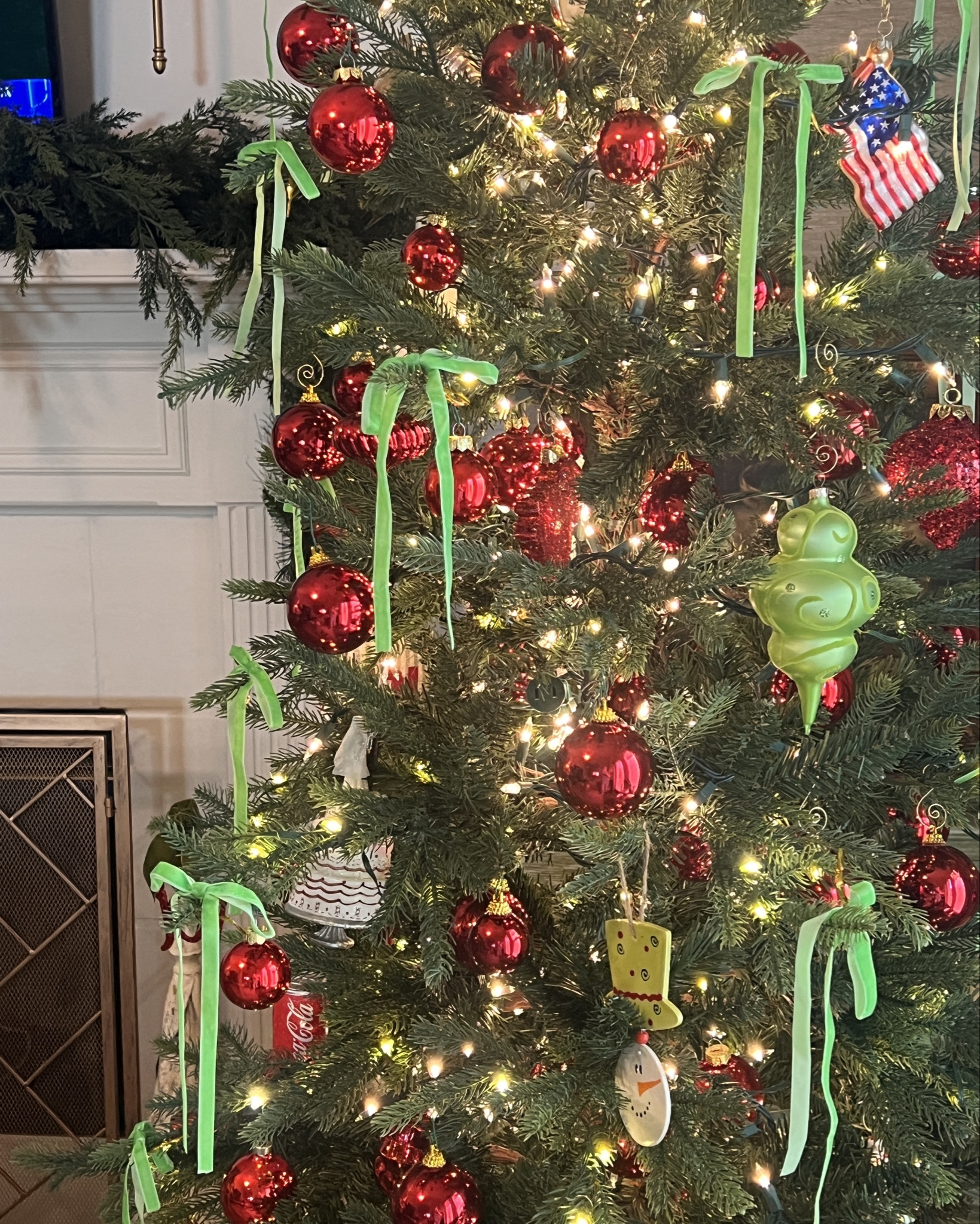 A classic Christmas tree dressed in rich red ornaments and sweet pops of velvet green ribbon. I mixed shiny and glittered red balls with sentimental ornaments for that cozy, collected holiday look. The soft green velvet ties add the perfect playful contrast and make the whole tree feel fresh, simple, and special. Linking all my go-to ornaments, ribbons, and tree staples for an easy, timeless holiday style. 

 #LTKHoliday #LTKSeasonal #LTKHome