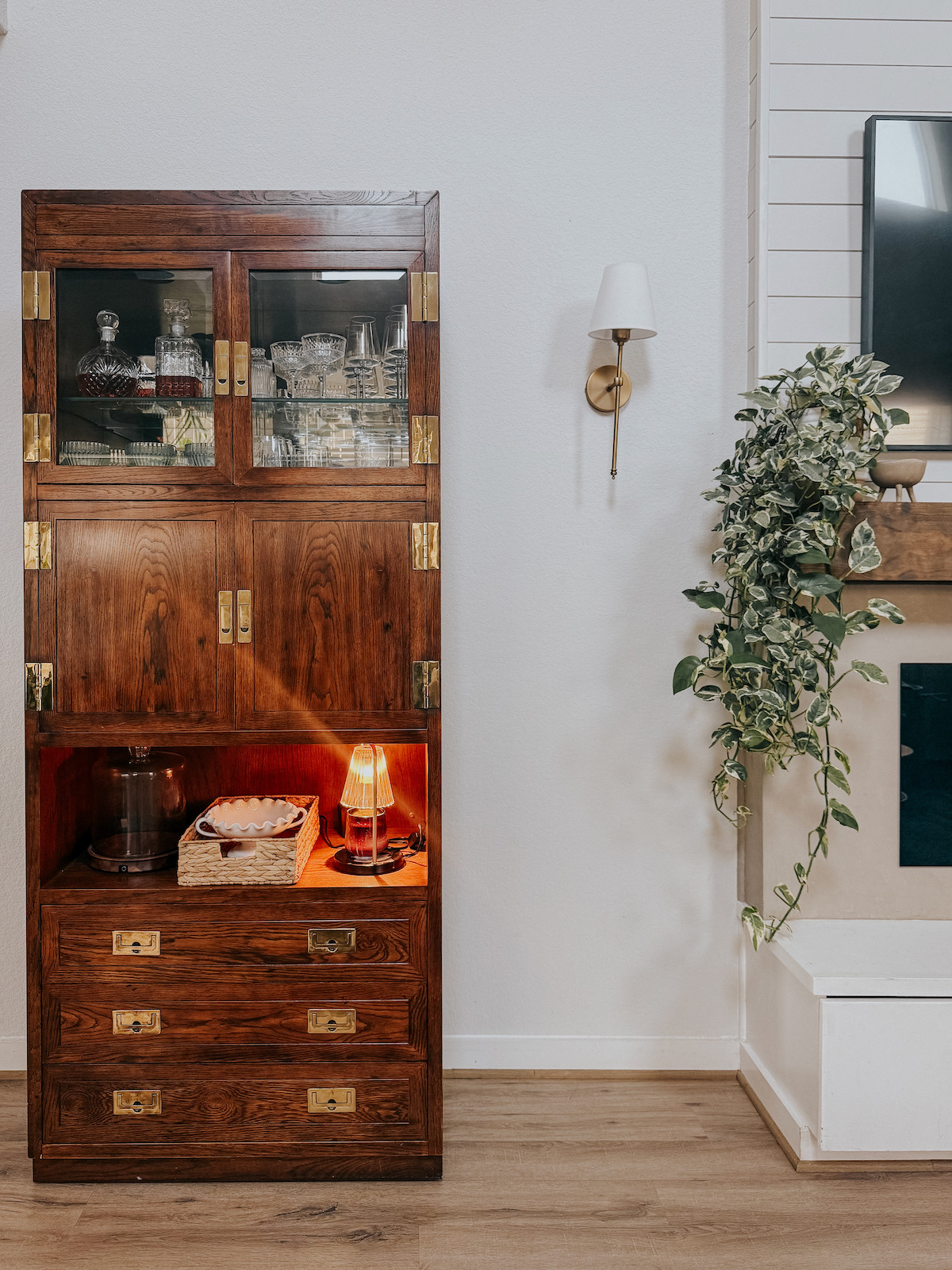 Two of my favorite lights in one photo - my cute wall sconces and the best candle warming lamp around!  

 #LTKHome #LTKFindsUnder50