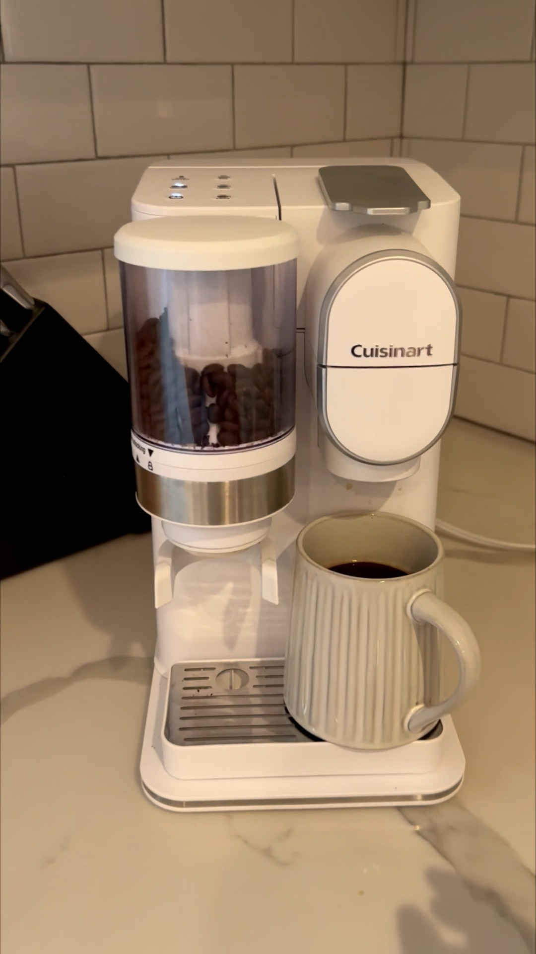 Love this versatile coffee maker - grinds and brews single cups and can use k-cups with it too for busier mornings.