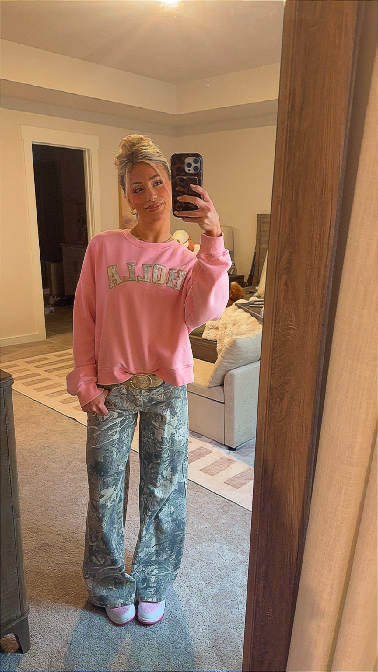 Pink + camo kind of day 💗🌿 Wearing my Holla sweatshirt from my brand, styled with camo flares, a statement belt + pink Nike dunks. 

 #LTKgrwm #LTKootd #LTKSeasonal